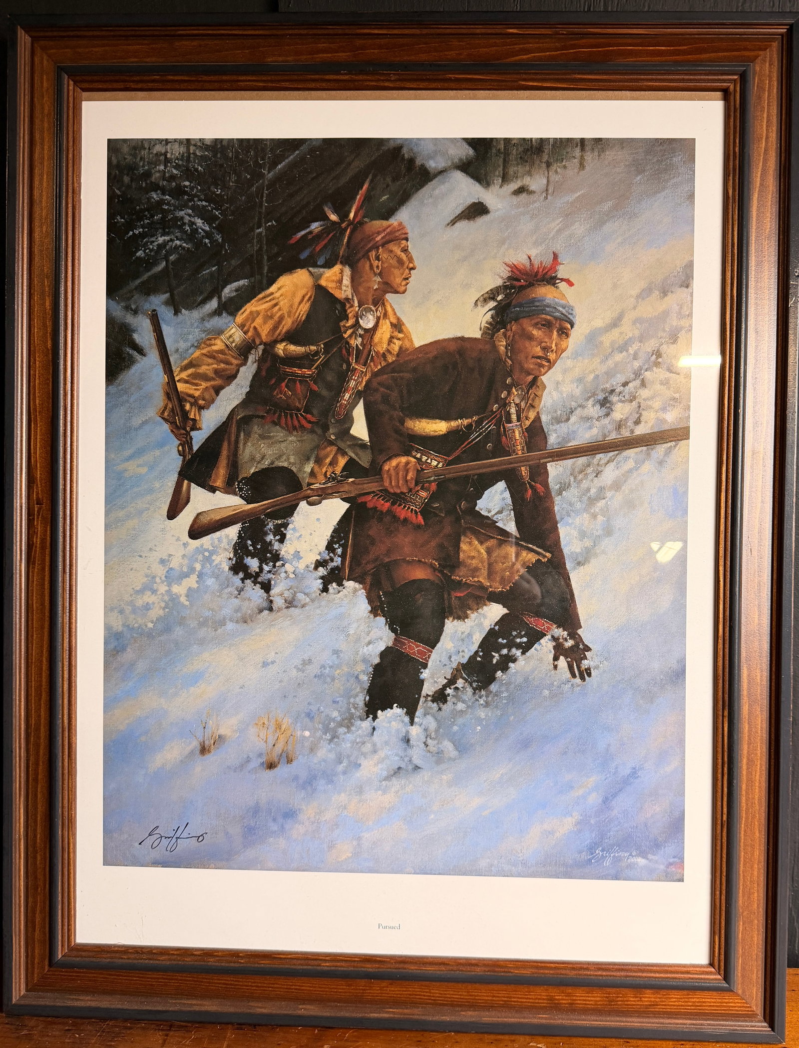 Robert Griffing Pursued Open Edition Lithograph: This open edition lithograph titled Pursued is a work by contemporary historical artist Robert Griffing, dated 2002. The artwork depicts two Native American men in period-accurate clothing and