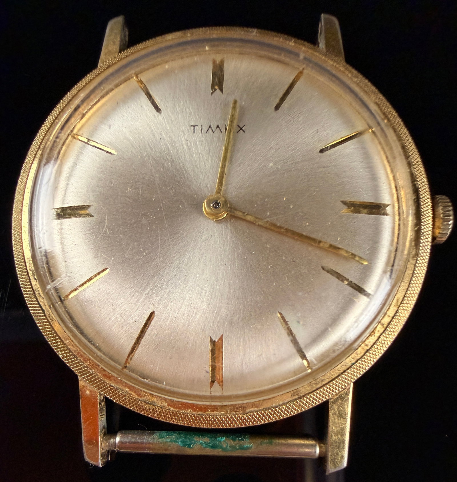 Vintage Timex Wafer Thin Manual Wind Wristwatch: A Timex Wafer Thin wristwatch featuring a manual wind mechanical movement. Watch winds but does not run. The timepiece consists of a gold-toned base metal bezel and a stainless steel case back. The si