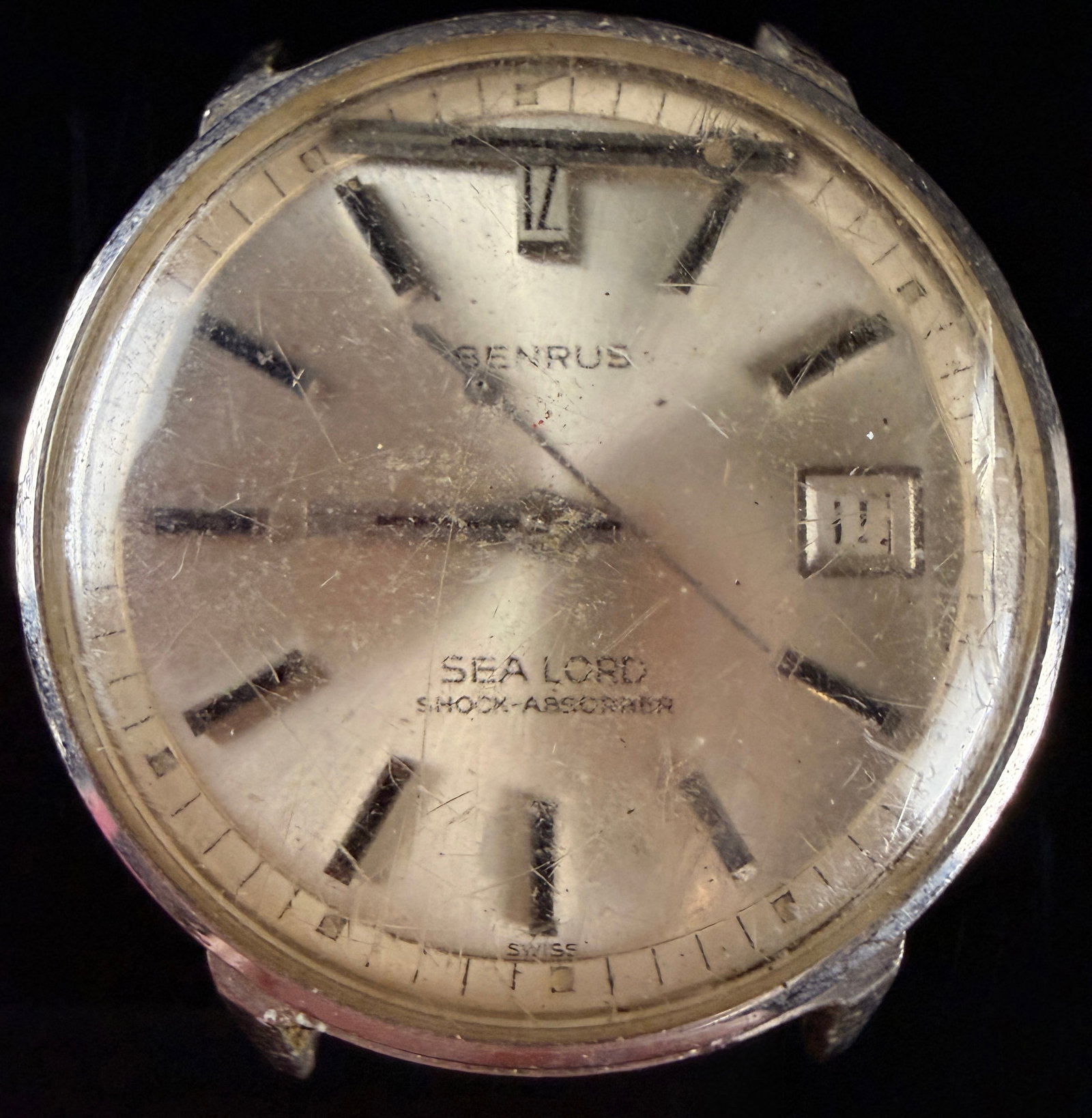 Benrus Sea Lord 14 Karat Gold Electroplated Wristwatch: This vintage Benrus Sea Lord wristwatch features a sunburst silver-tone dial with applied baton hour markers and a date window at the 3 o'clock position. Watch does not run loose hands missing the cro