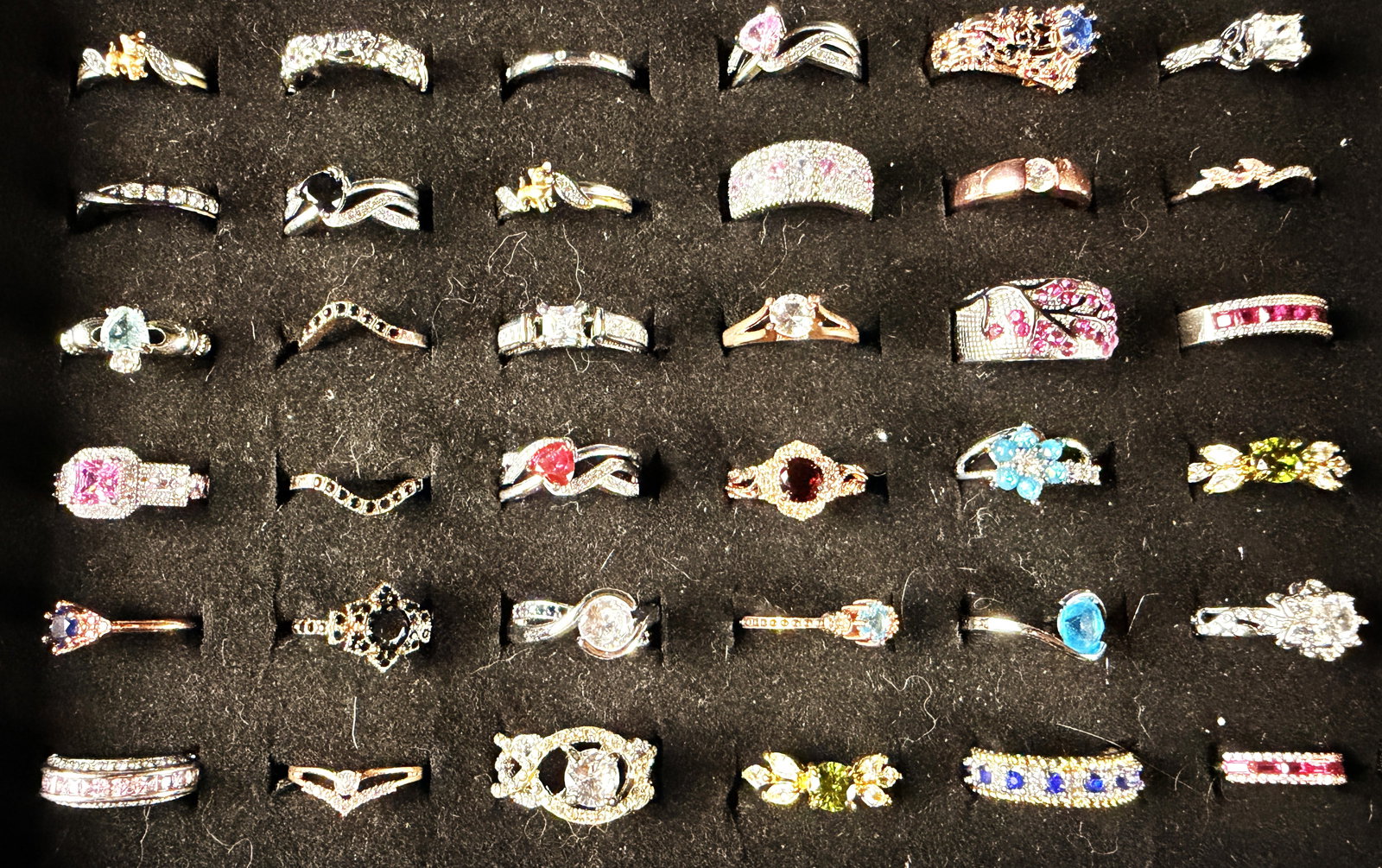 Contemporary Fashion Rings in Sterling Silver and Mixed Metal Tones: This collection consists of rings in a variety of contemporary styles and finishes, including silver-tone, yellow gold-tone, and rose gold-tone. One ring shank is clearly marked S925, indicating sterl