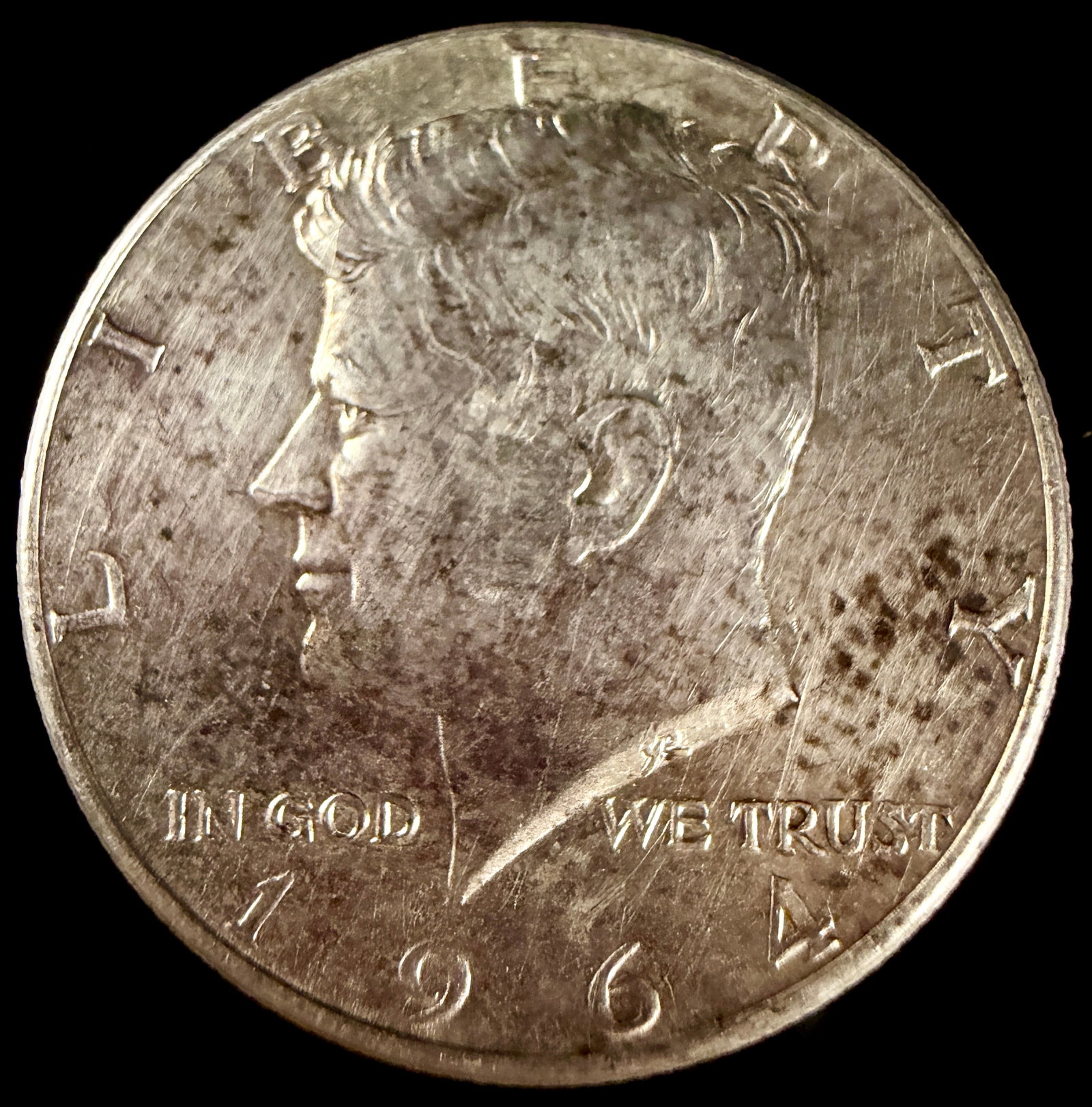 Three US 90% Silver Coins, 1923-1964: Three US silver coins comprising a 1964 Kennedy half dollar, a 1951 Franklin half dollar, and a 1923 Mercury dime. The coins are struck in 90% silver and feature reeded edges. These pieces were produc