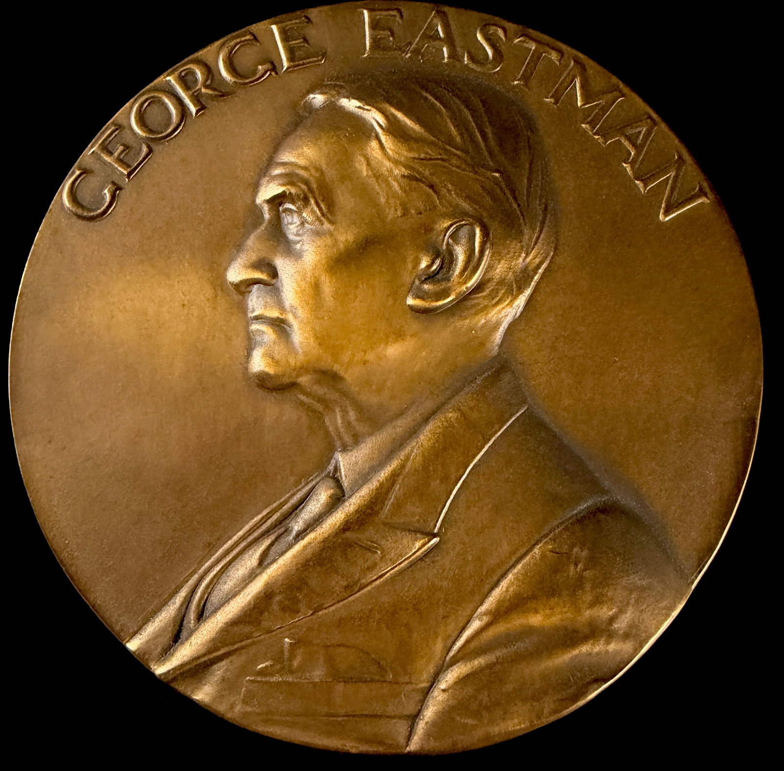 1968 George Eastman Kodak Company 25 Year Service Bronze Medal: This 1968 bronze-composition commemorative service medal was issued by the Eastman Kodak Company. The obverse features a high-relief profile bust of George Eastman with the raised legend GEORGE EASTMA