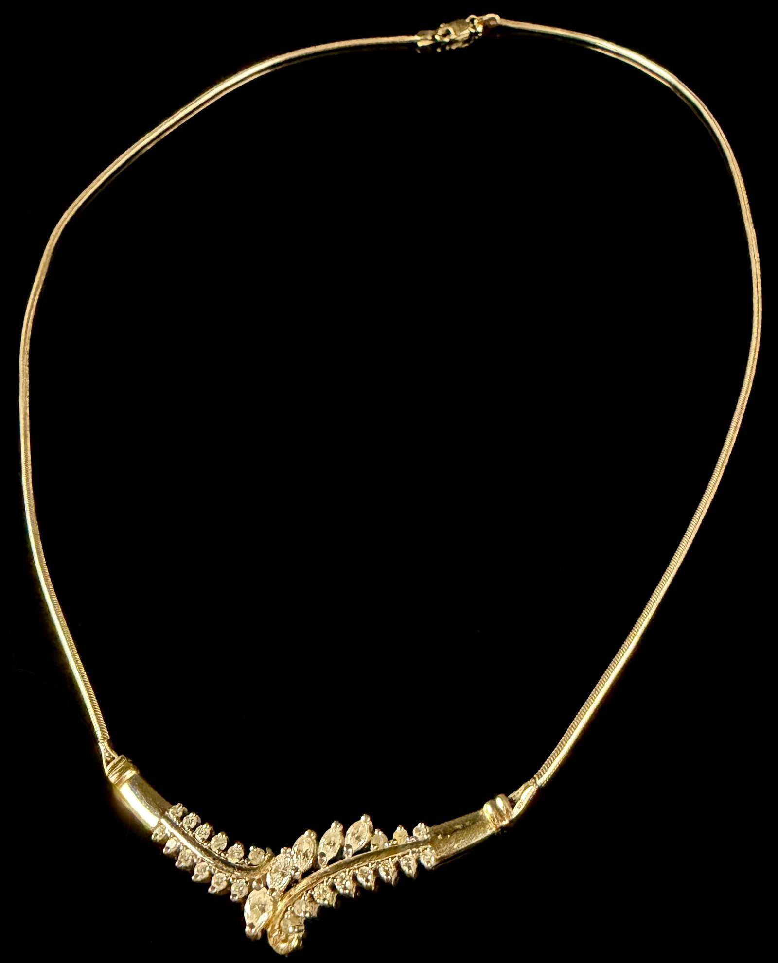 10K & 14K Yellow Gold and Diamond Chevron Diamond Necklace: 14K Gold and Marked Center element which houses the Diamonds, the chain is 10k Gold. Floraland foliate spray patterns found in their fine jewelry collections from the late 20th century. The central pi