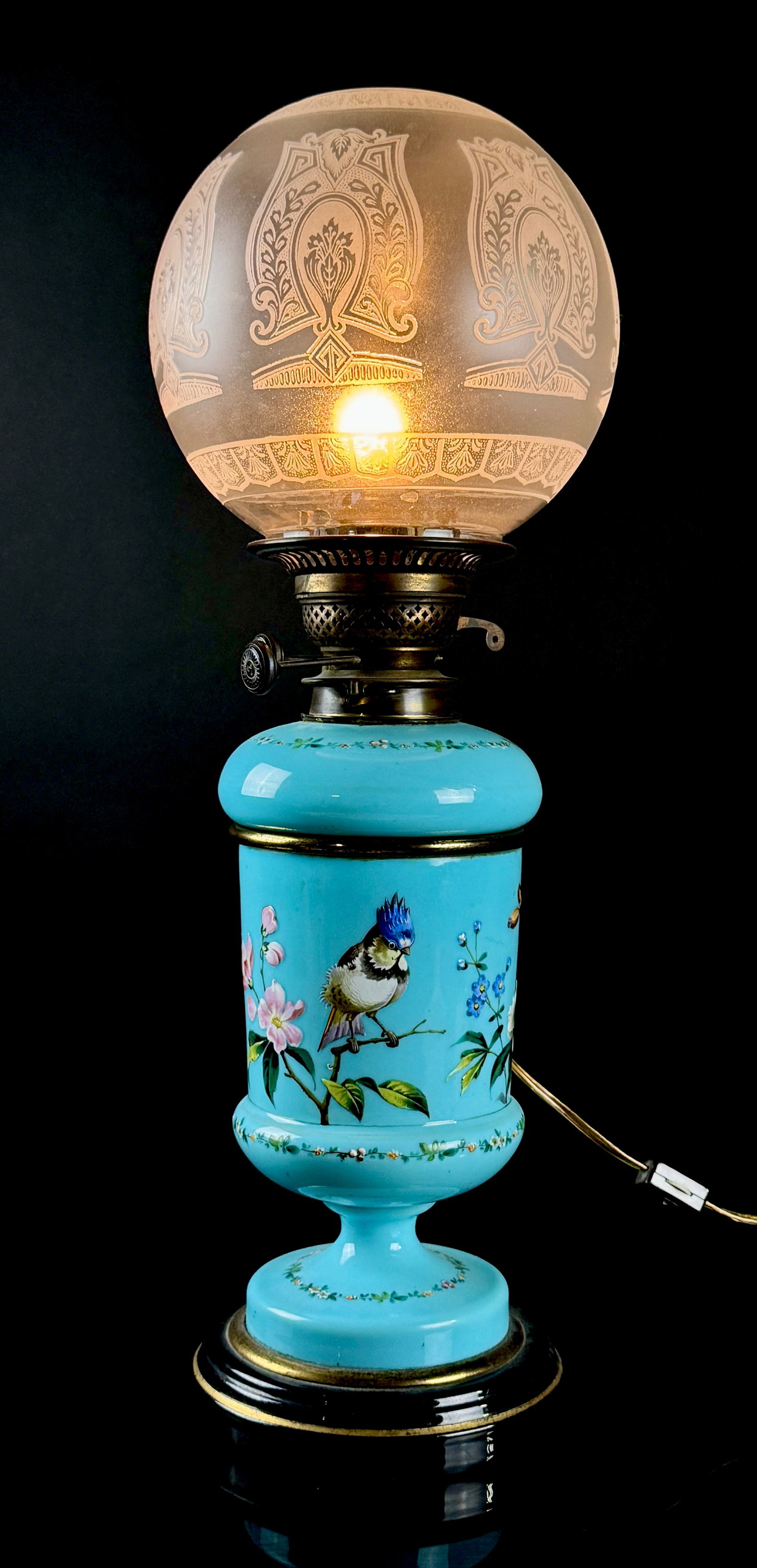 Victorian James Hinks and Son Hand Painted Blue Opal Glass Table Lamp: Victorian oil lamp manufactured by James Hinks and Son of Birmingham, England, subsequently converted for electric use. The lamp features a light blue opal glass body, commonly referred to as Bristol