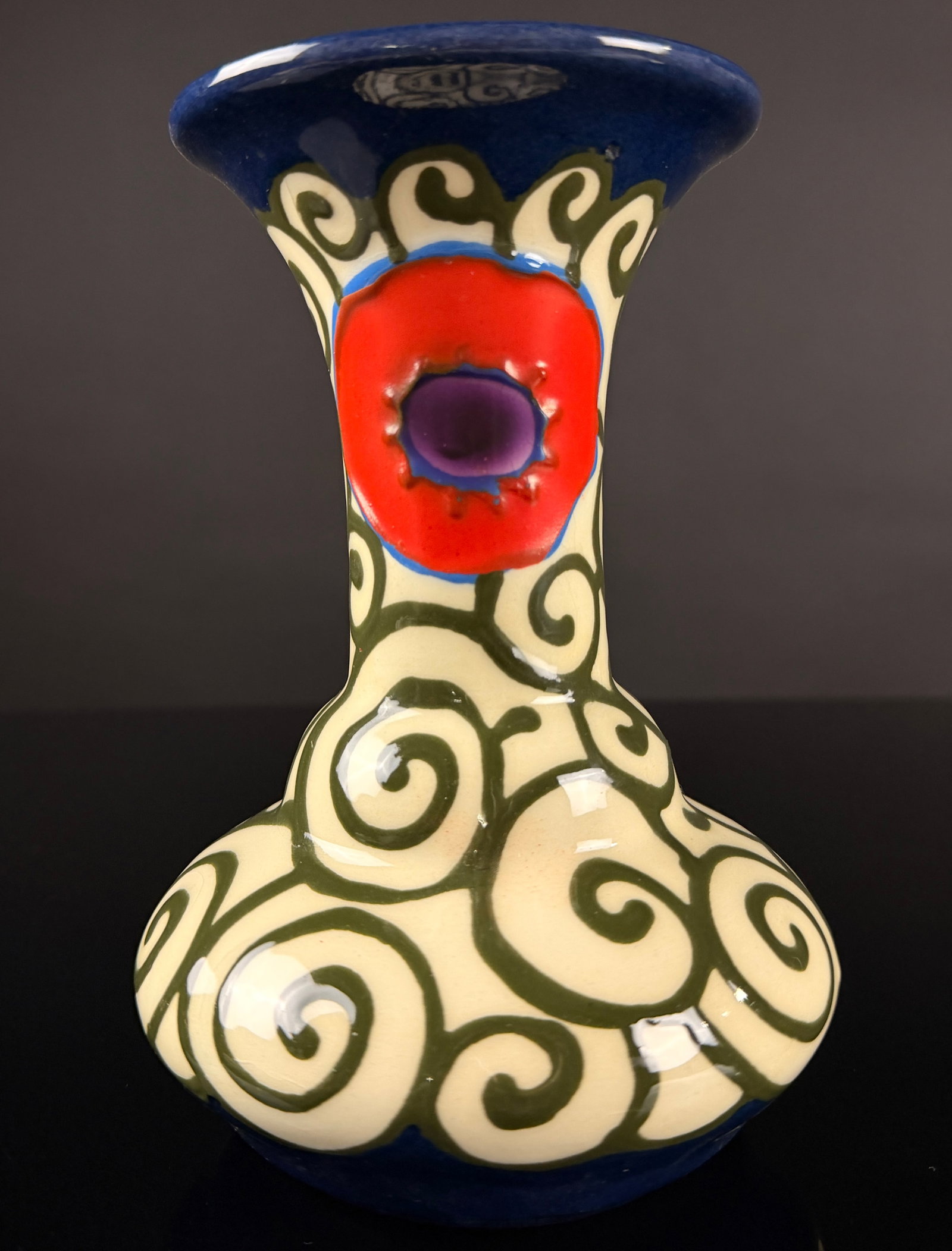 Ditmar Urbach Czech Art Deco Flora Pattern Pottery Vase: This Art Deco earthenware vase is produced in the Flora pattern, attributed to the Ditmar Urbach factory in Czechoslovakia. The piece features a bulbous lower body that tapers into a slender neck, ter