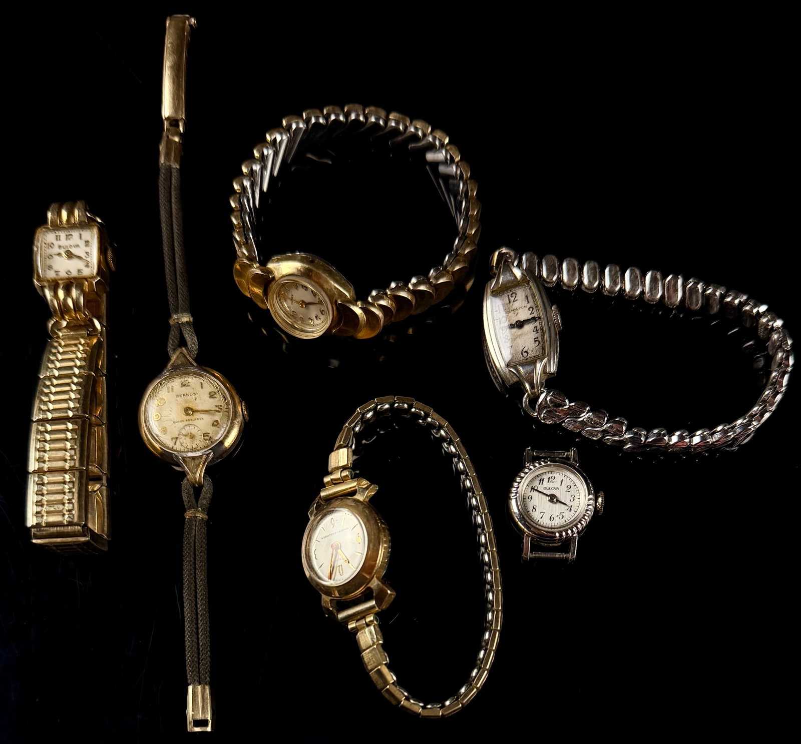 A Collection of Vintage Ladies Wristwatches Including Bulova Hamilton and Benrus: This collection of vintage ladies mechanical wristwatches features a variety of American and Swiss-made timepieces from the mid to late 20th century. The assortment includes a Bulova square tank-style