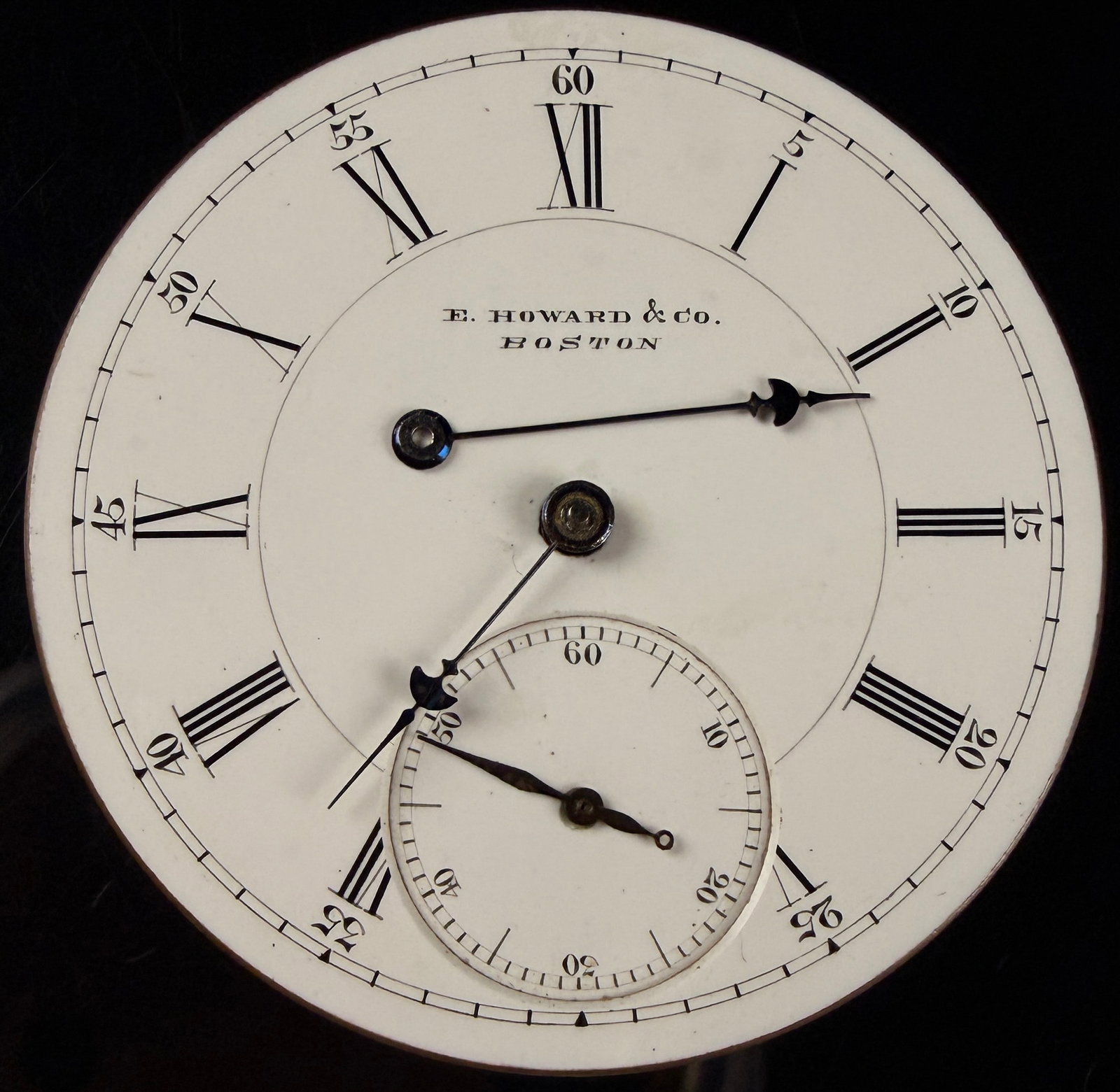 E. Howard and Co. Boston Grade L Series V 16 Size Pocket Watch Movement and Dial: An antique American pocket watch movement and dial manufactured by E. Howard and Co. of Boston, Massachusetts. The movement is identified as a Series V, 16 size, Grade L. It features a nickel finish w