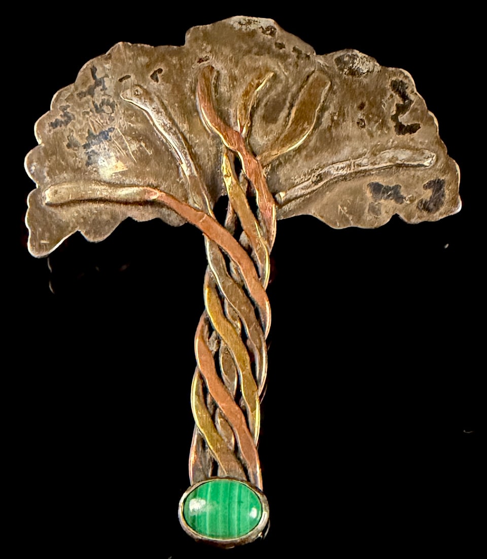 Vintage Mixed-Metal Tree Motif Brooch with Malachite Cabochon: A vintage mixed-metal brooch fashioned as a stylized tree. The trunk is constructed from twisted copper, brass, and silver-toned metal wires. The canopy is formed from a hand-textured silver-toned met