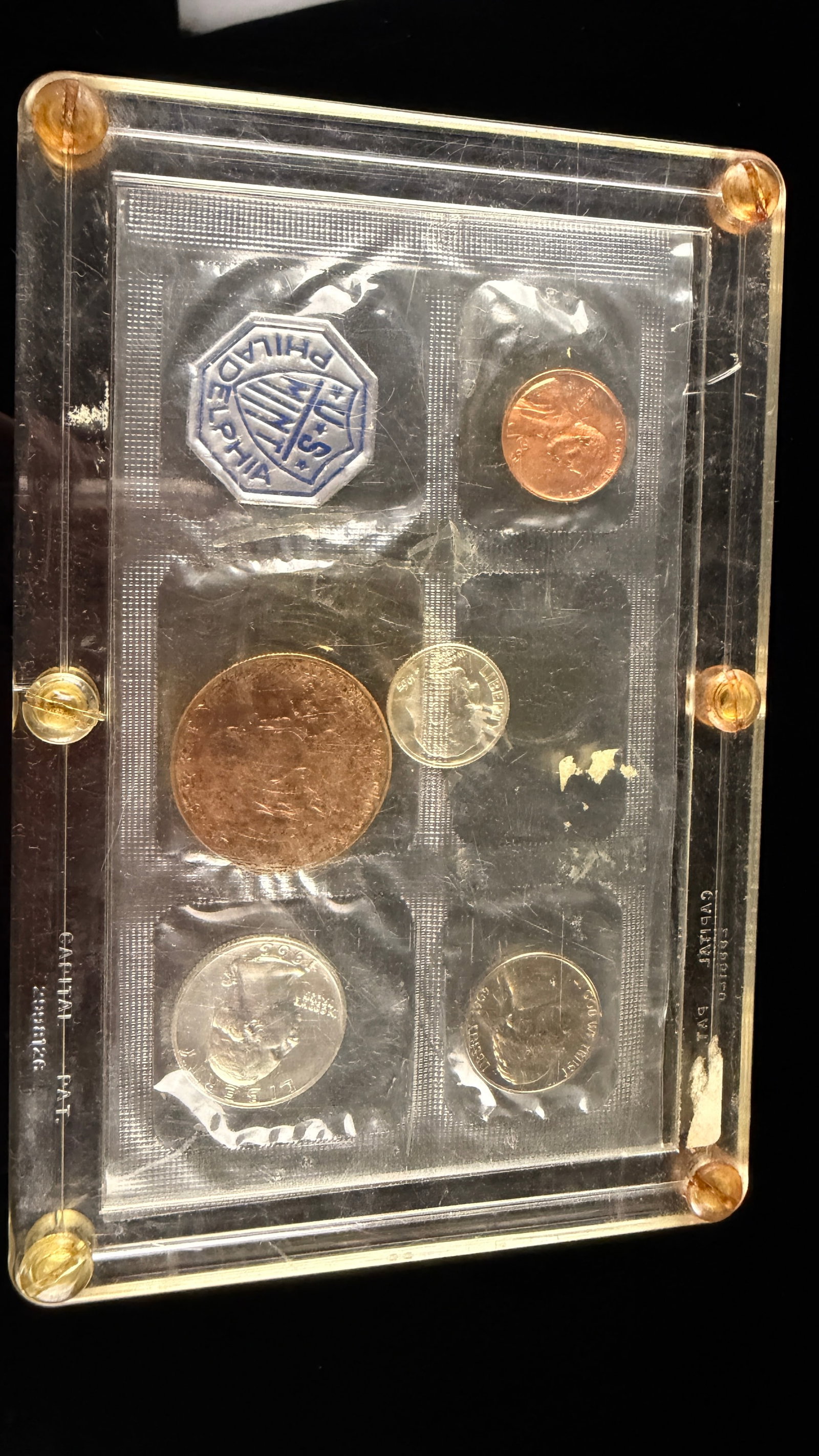 A 1963 US Proof Set: A 1963 US Proof Set from the Philadelphia Mint. This collection of coins includes five denominations: a Lincoln cent, a Jefferson nickel, a Roosevelt dime, a Washington quarter, and a Franklin half do