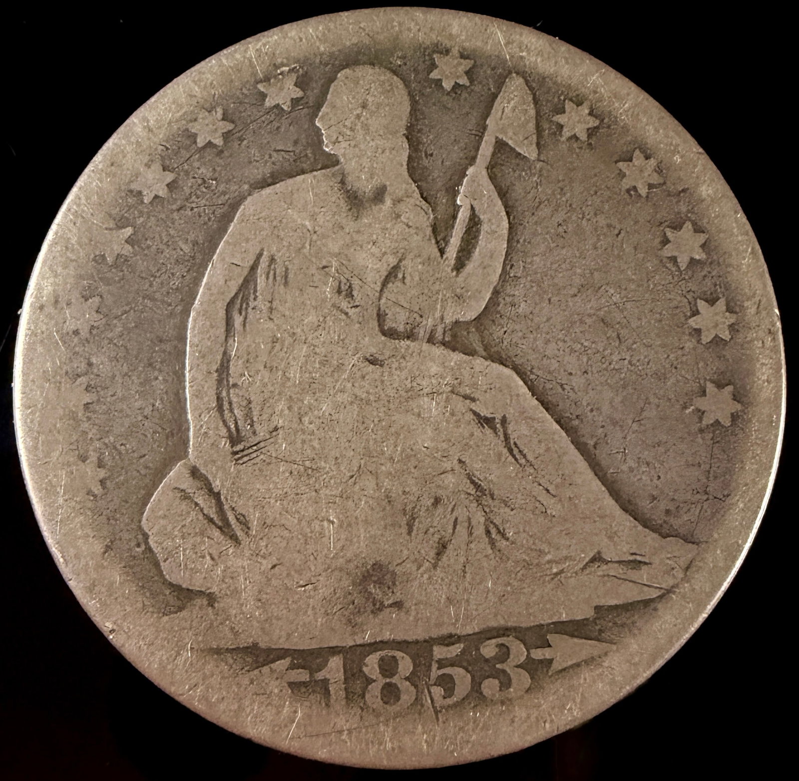1853 US Seated Liberty Silver Half Dollar, Arrows and Rays: This is an 1853 US Seated Liberty silver half dollar, a one-year type identified by the "Arrows at Date and Rays at Eagle" variety. Struck at the Philadelphia Mint, the coin features the Seated Libert