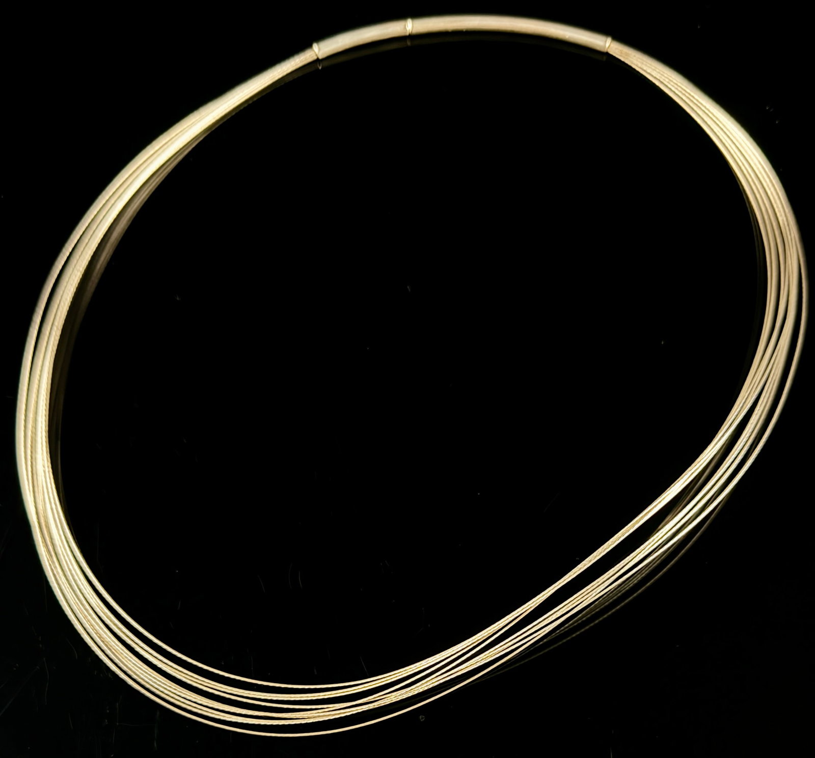 Sejin Gold-Toned Sterling Silver Multi-Strand Collar Necklace: A contemporary multi-strand collar necklace produced by Sejin. The design features several fine, flexible wires gathered together into smooth, gold-toned tubular end caps. The piece is constructed