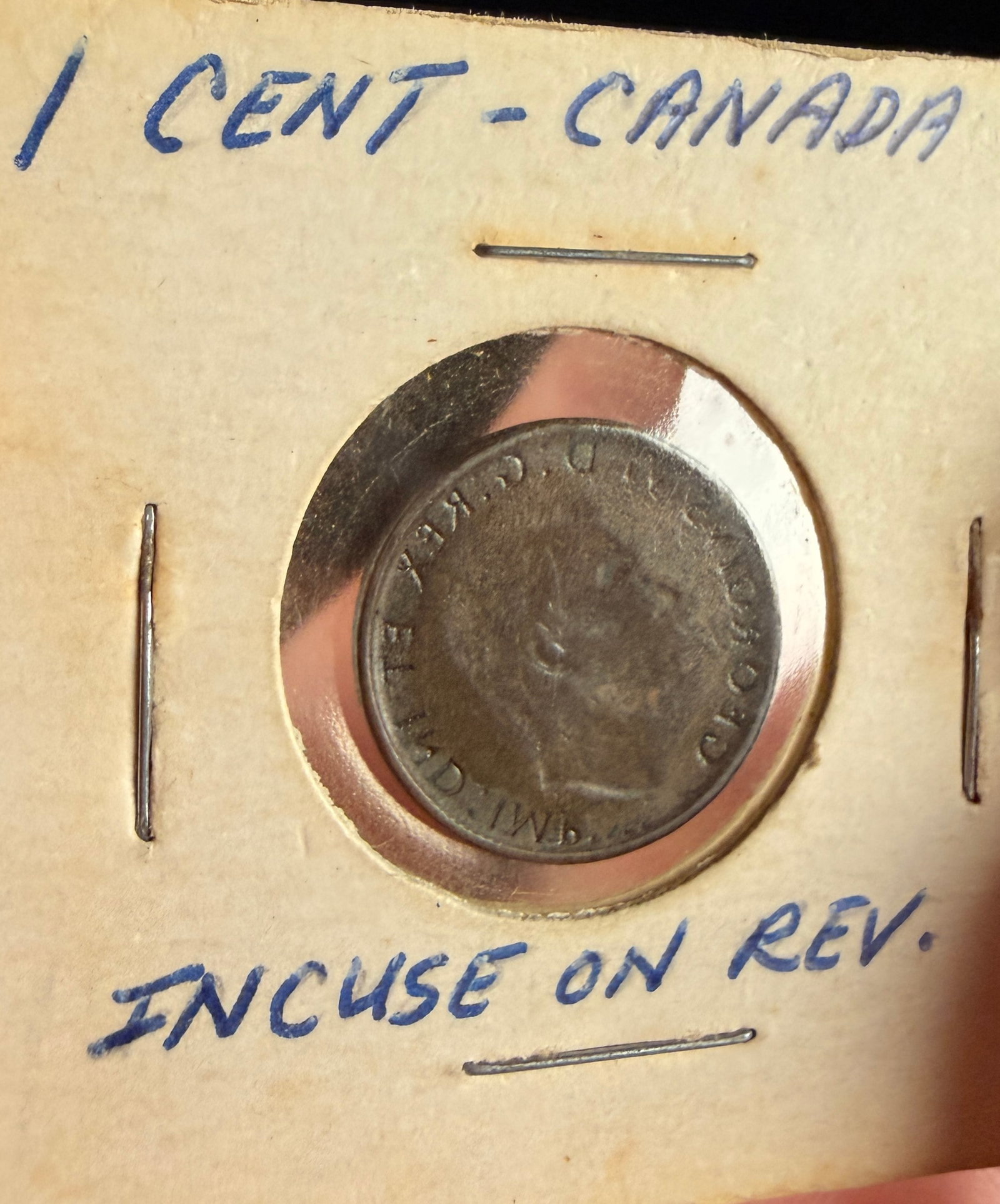 Canada King George VI 1-Cent Coin, Full Obverse Brockage Error: This Canadian 1-cent coin features a significant mint error known as a full obverse brockage. The coin was struck during the reign of King George VI, specifically between 1937 and 1947 as indicated by