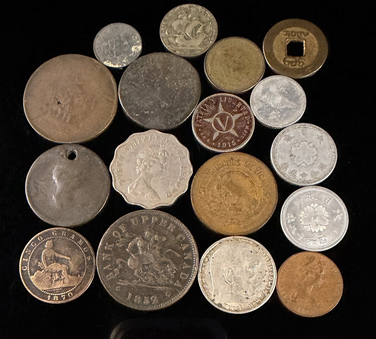 A Collection of Mixed World Coins and Tokens including CA, DE, ES, HK, PT, CU, MX, JP, and CN (1 of 20)