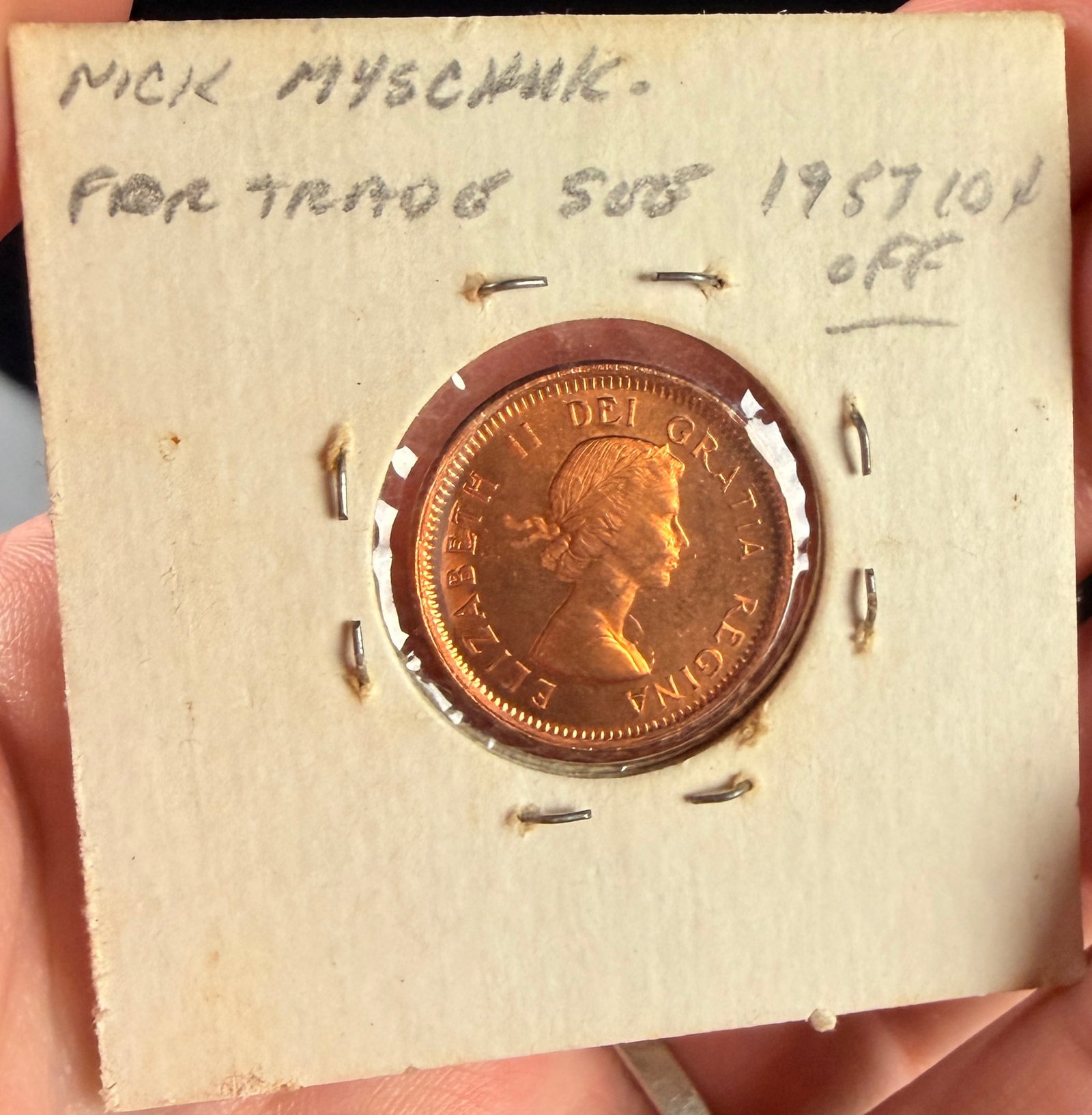 1963 Canada 1-Cent Coin Broadstrike Mint Error: This Canadian 1-cent coin, dated 1963, is a broadstrike mint error, characterized by having been struck without the restraining collar. This production error allowed the copper planchet to expand