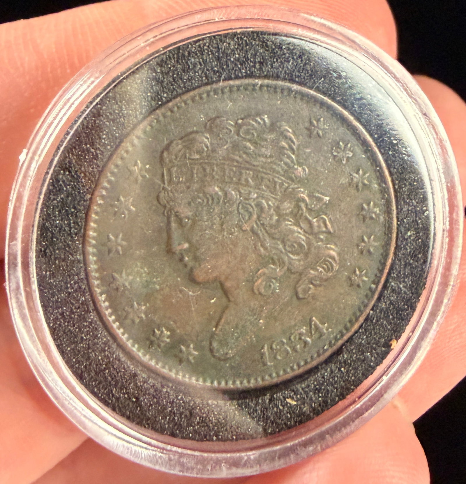 US 1834 Classic Head Half Cent: This US 1834 Classic Head Half Cent is struck in copper. The obverse features the Classic Head design depicting Liberty facing left wearing a headband inscribed with LIBERTY, surrounded by thirteen