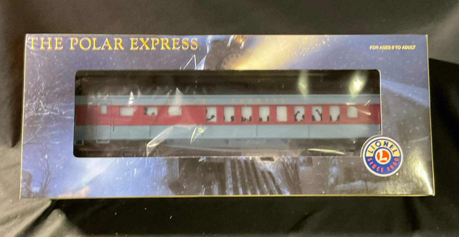Lionel O-Gauge The Polar Express Diner Car Model 6-25134 in Original Box: This is a Lionel O-Gauge model train passenger car identified as The Polar Express Diner Car, model number 6-25134. The car features a plastic body construction with metal trucks and couplers. It is f