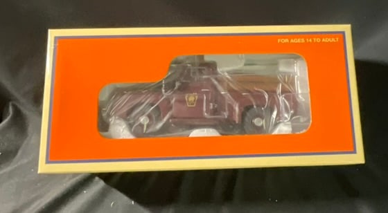 Lionel O-Gauge Pennsylvania Railroad 1955 Inspection Truck No. 6-39530: A Lionel O-gauge motorized inspection truck, model 6-39530. This unit is constructed with a die-cast metal body and frame modeled after a 1955 pickup truck. The vehicle is finished in a maroon paint s