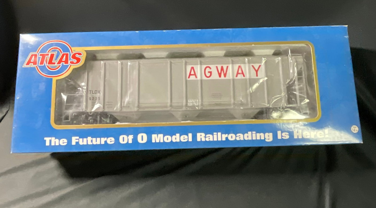 Atlas O Master PS-4427 Low-side Hopper Agway TLDX 5235 3-Rail: This Atlas O scale model railroad freight car is a PS-4427 low-side covered hopper from the Atlas Master Rolling Stock line. The model is designed for 3-rail operation and is constructed primarily fro