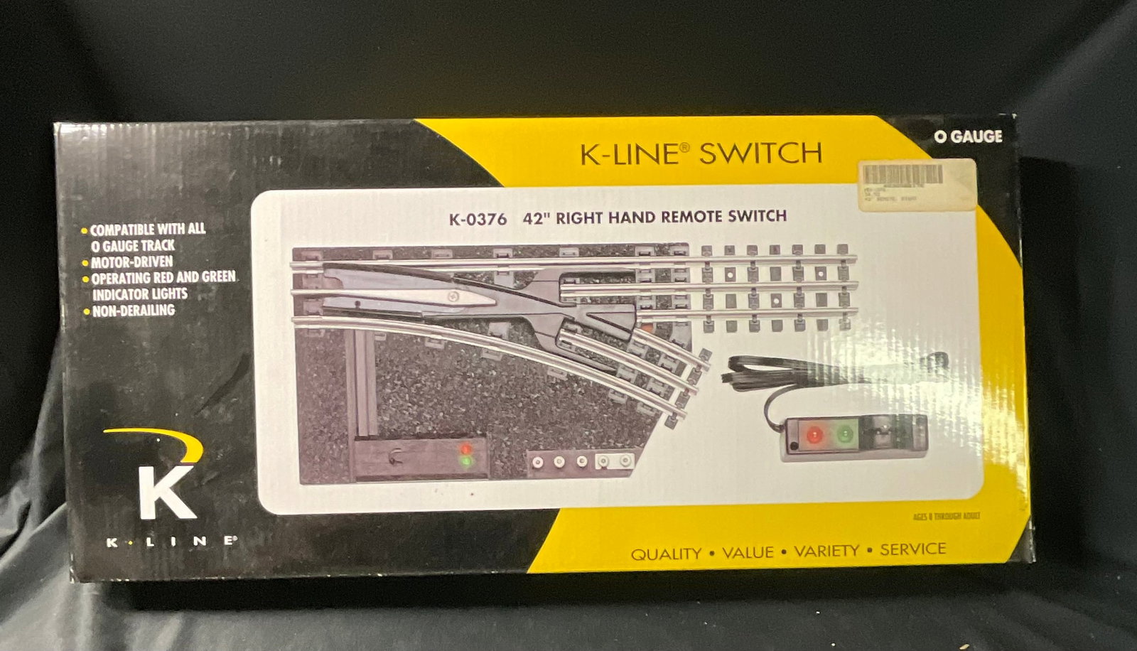 K-Line K-0376 O Gauge 42 Inch Right Hand Remote Control Switch with Original Box: This is a K-Line model number K-0376 O gauge 42-inch radius right-hand remote control switch turnout. The unit is constructed with metal rails mounted on a textured plastic roadbed designed to resembl