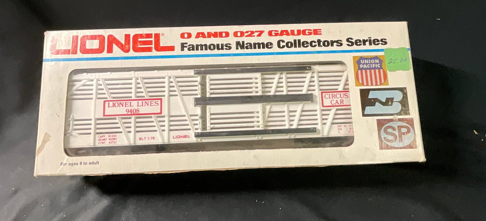 Lionel Lines O Gauge No. 9408 Circus Stock Car in Original Box: A Lionel O and O27 gauge model railroad stock car, catalog number 9408, from the Famous Name Collectors Series. The car body is constructed of molded white plastic and features applied red and black g