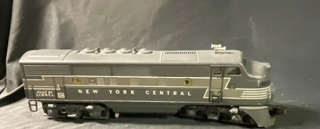 Lionel New York Central F3 Diesel Locomotive A-Unit Model 2354: This Lionel model 2354 New York Central F3 diesel locomotive A-unit features a plastic body shell with a metal frame and die-cast metal trucks. The item is finished in the two-tone gray Lightning Bolt