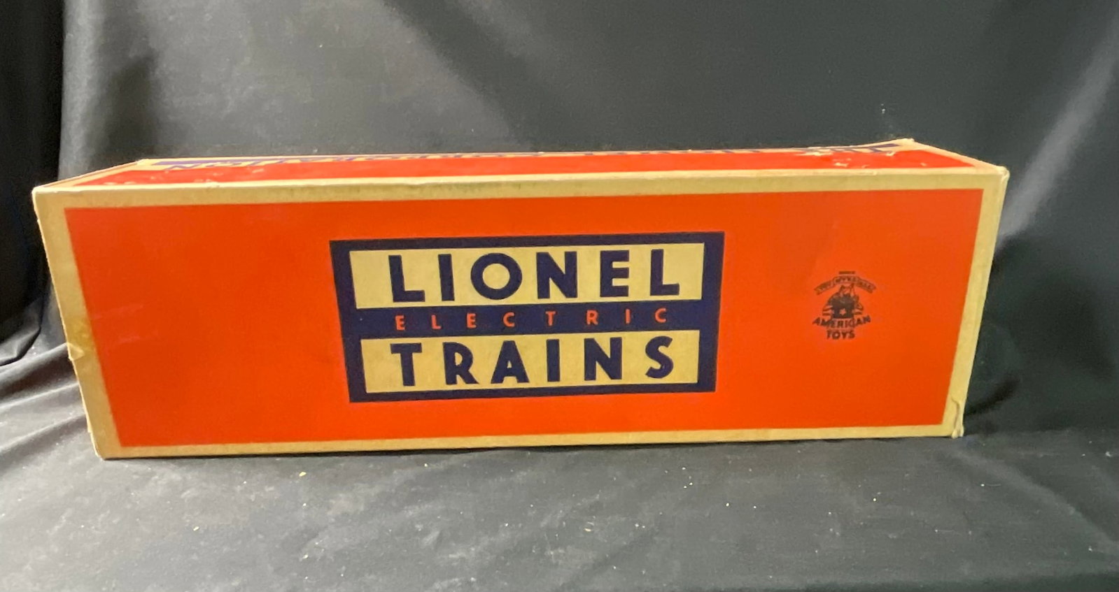 Lionel No. 601 Seaboard Diesel Switcher Locomotive and Original Box: A Lionel No. 601 Seaboard diesel switcher locomotive. The locomotive features a plastic body shell in a black and red livery over a die-cast metal chassis and trucks. Exterior details include white pr