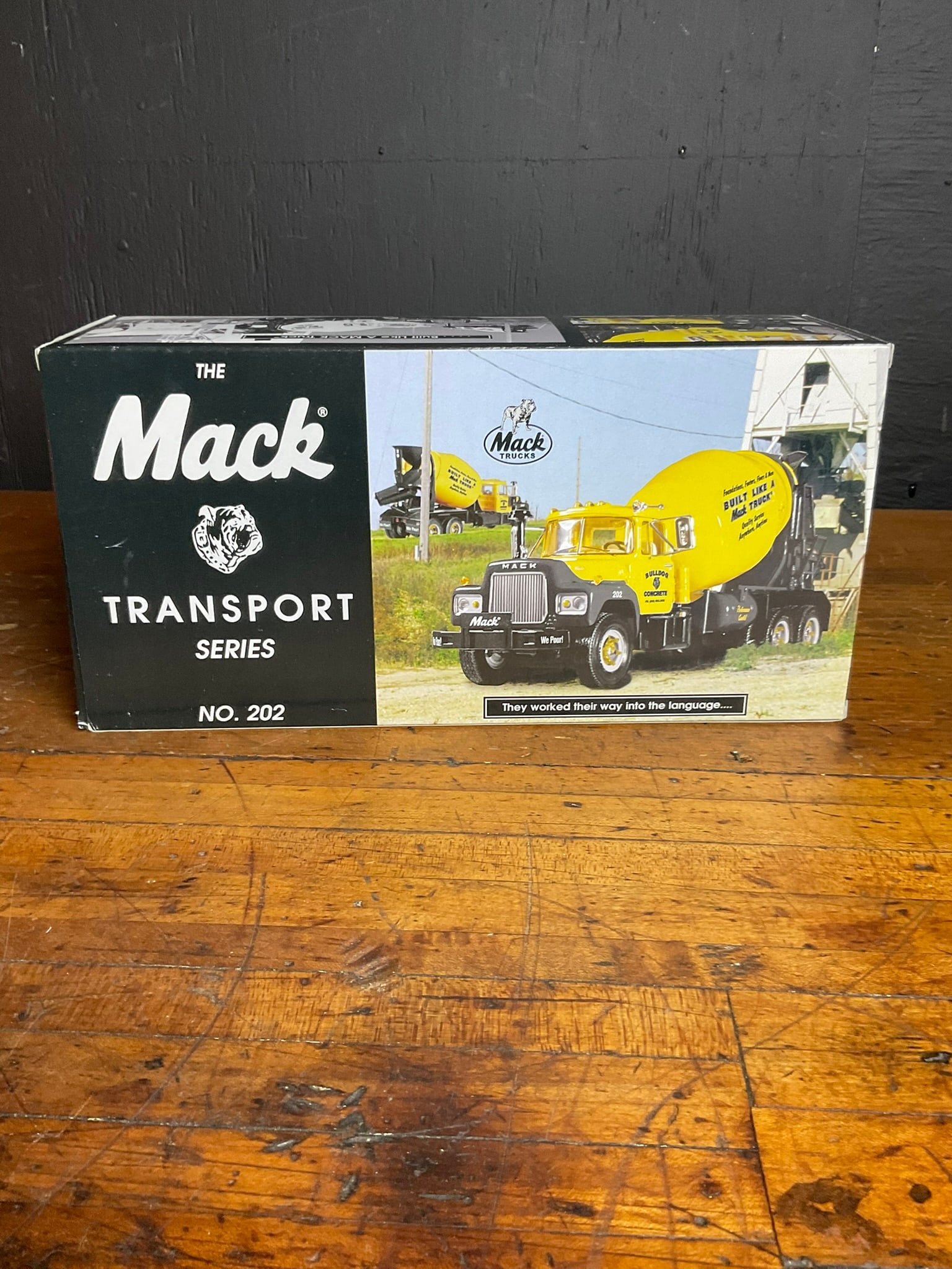 A Pair of Die-Cast Model Trucks Including a First Gear Mack Transport Series R-600 Mixer and a (1 of 8)