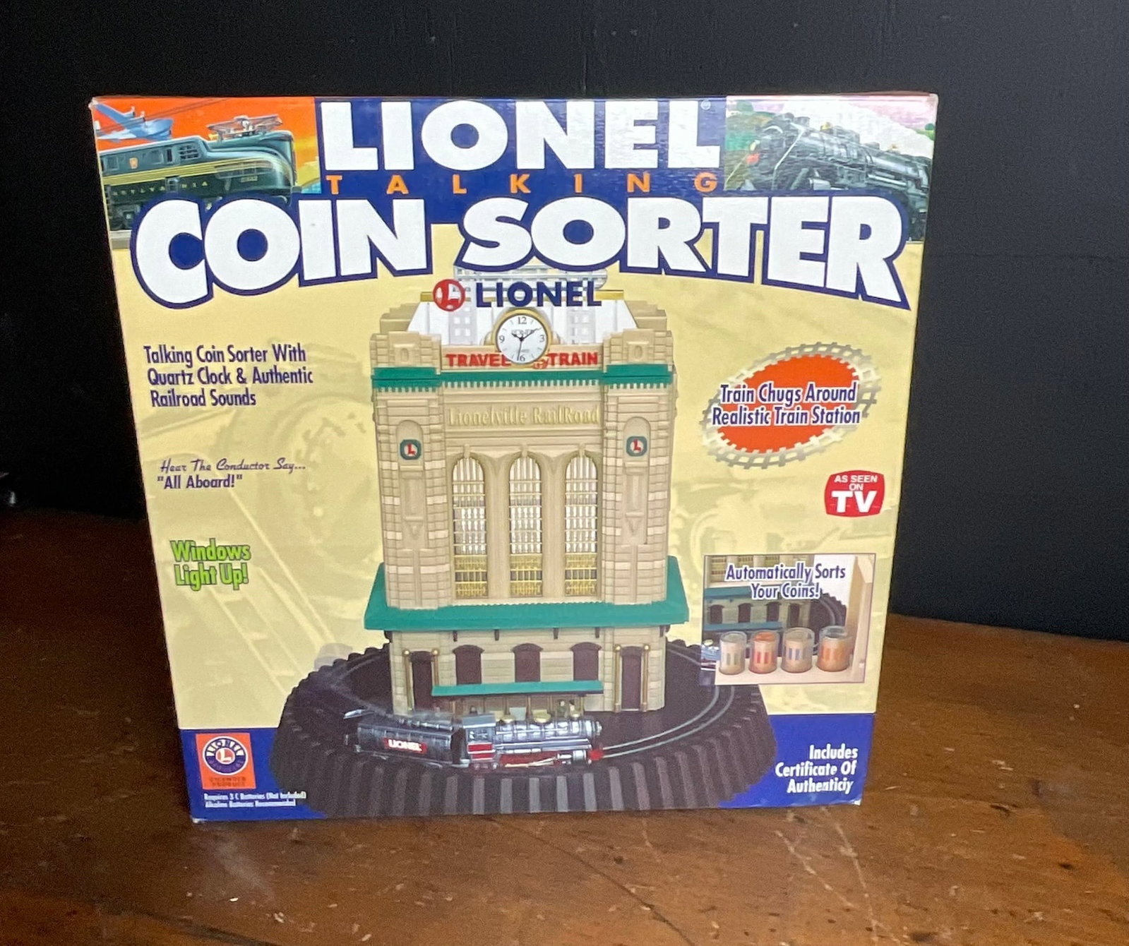 Lionel Talking Coin Sorter Animated Bank in Original Box: This animated talking coin sorter bank was manufactured by Emson under license from Lionel LLC. The toy features a predominantly plastic construction and is powered by three C batteries. The unit is c