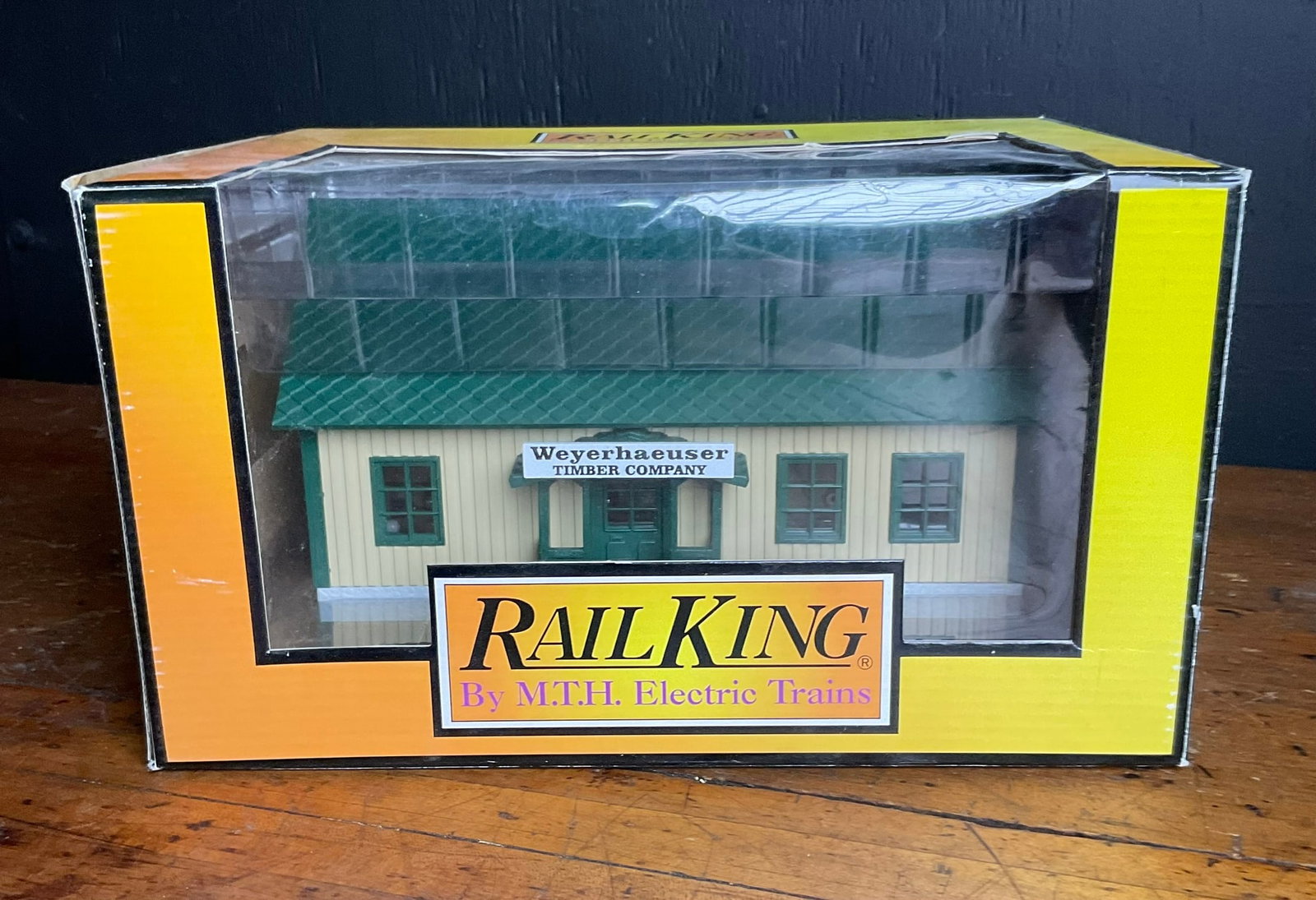 RailKing O Gauge Weyerhaeuser Timber Co. Logging Camp Bunk House 30-90138 by M.T.H. Electric Trains: This is a RailKing O Gauge model railroad accessory manufactured by M.T.H. Electric Trains, specifically the Weyerhaeuser Timber Co. Logging Camp Bunk House, model number 30-90138. The structure is co