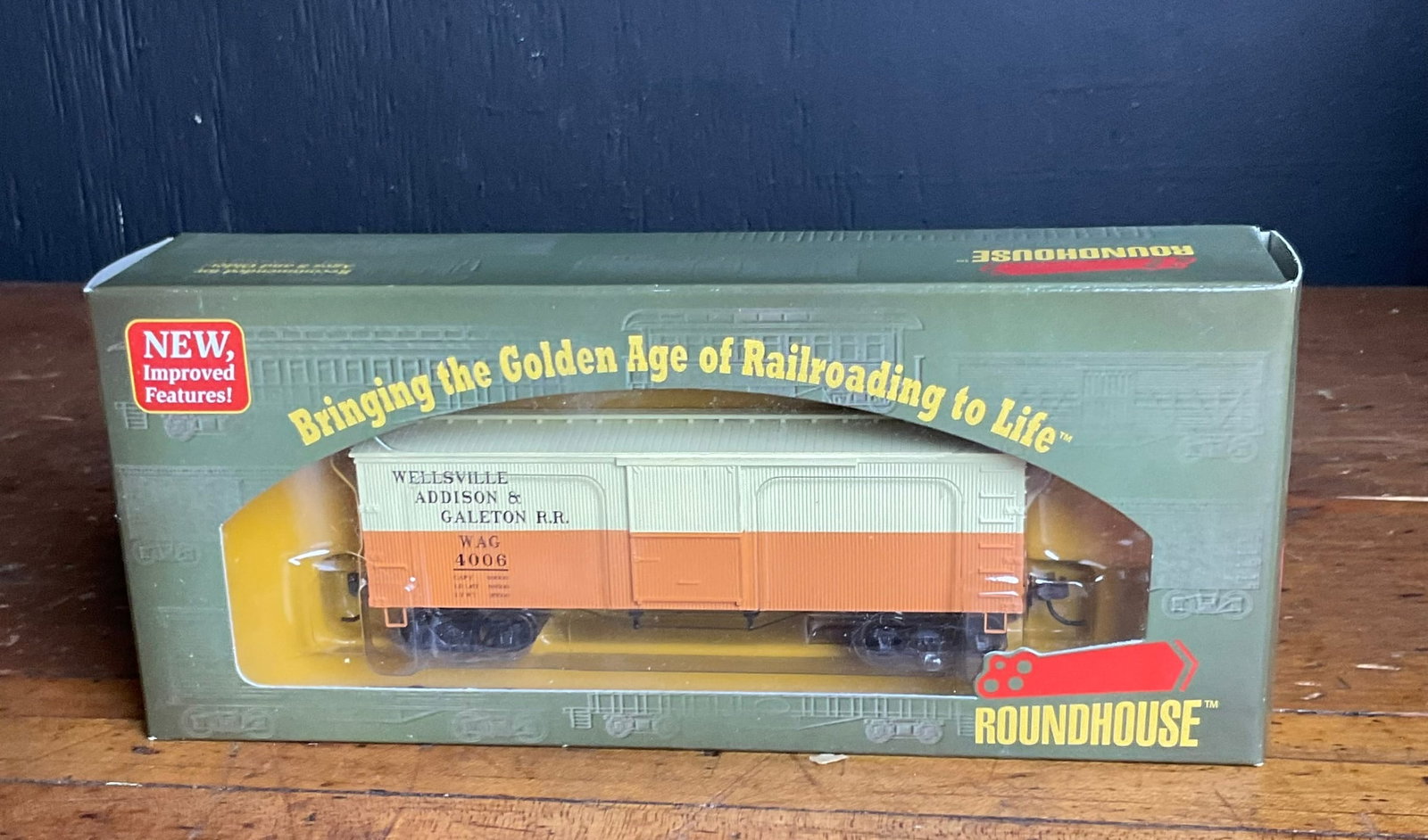 Roundhouse HO Scale Wellsville Addison & Galeton 36 Foot Box Car 4006: A Roundhouse HO scale model railroad freight car representing a 36-foot wood-side boxcar. The car is decorated in the Wellsville Addison & Galeton Railroad (WAG) livery, featuring a two-tone paint sch