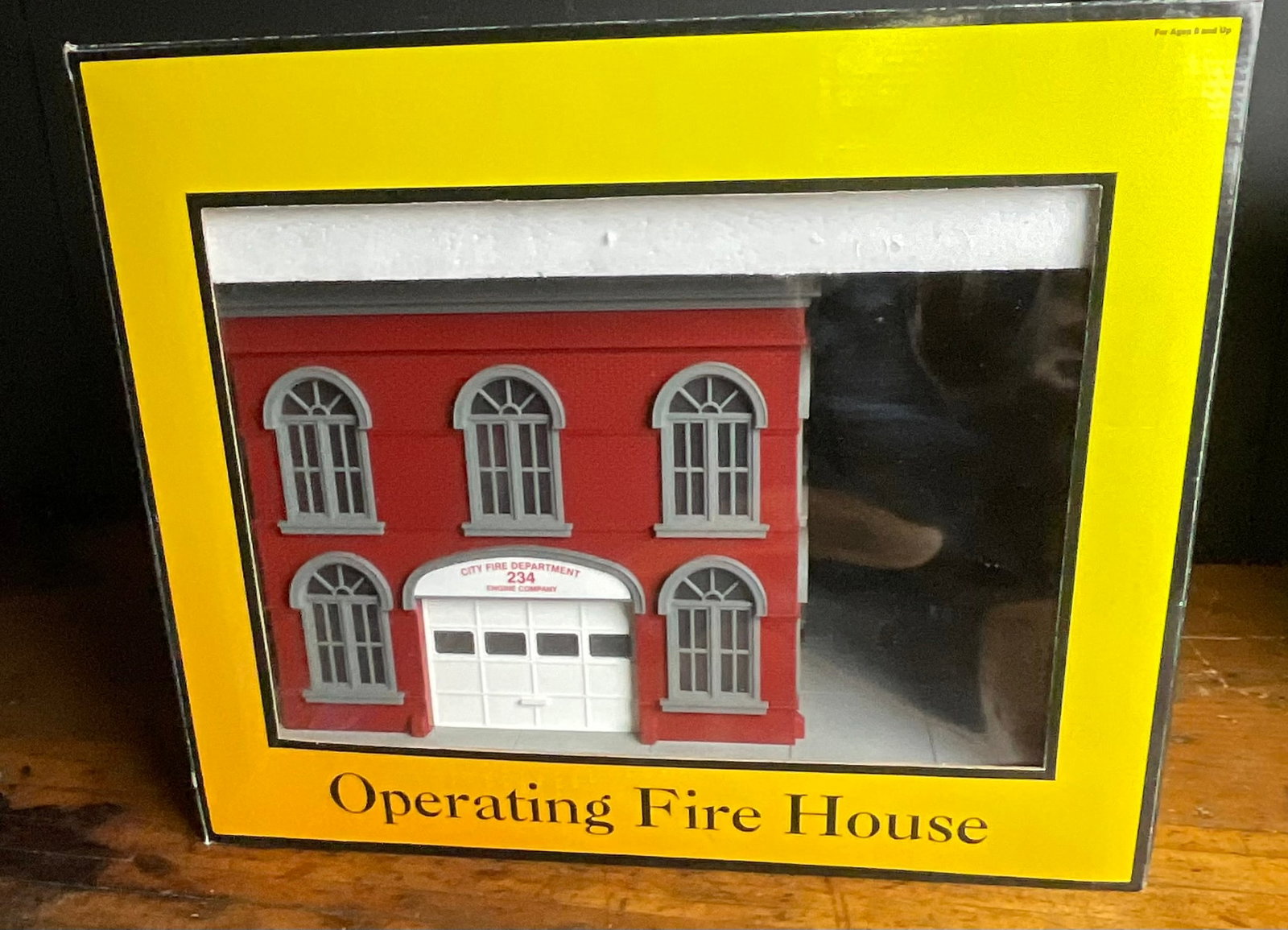 RailKing by MTH Electric Trains O-Gauge Operating Fire House Item No. 30-9102: This is an O-gauge operating firehouse manufactured by MTH Electric Trains under the RailKing brand, designated as Item No. 30-9102. The structure is primarily of plastic construction and features a r