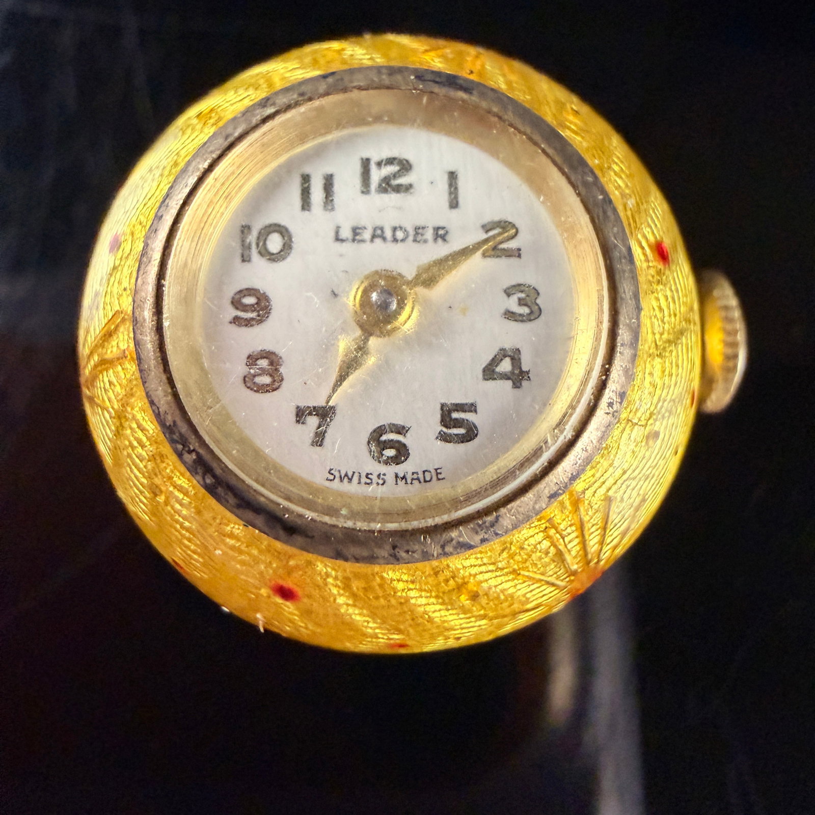 Leader Vintage Swiss Made Ball Pendant Watch: A vintage ball-form pendant watch produced by Leader. The spherical case is constructed from metal with yellow gold-tone plating and a contrasting silver-tone central band. The exterior features intri