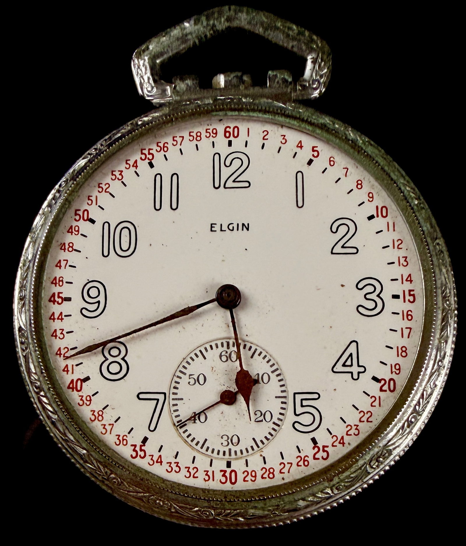 Elgin Size 12 Open Face Pocket Watch with Montgomery Dial: An antique Elgin open face pocket watch featuring a white Montgomery style dial. The dial is characterized by black Arabic hour numerals and a red outer minute track with individual numbers from 1 to 