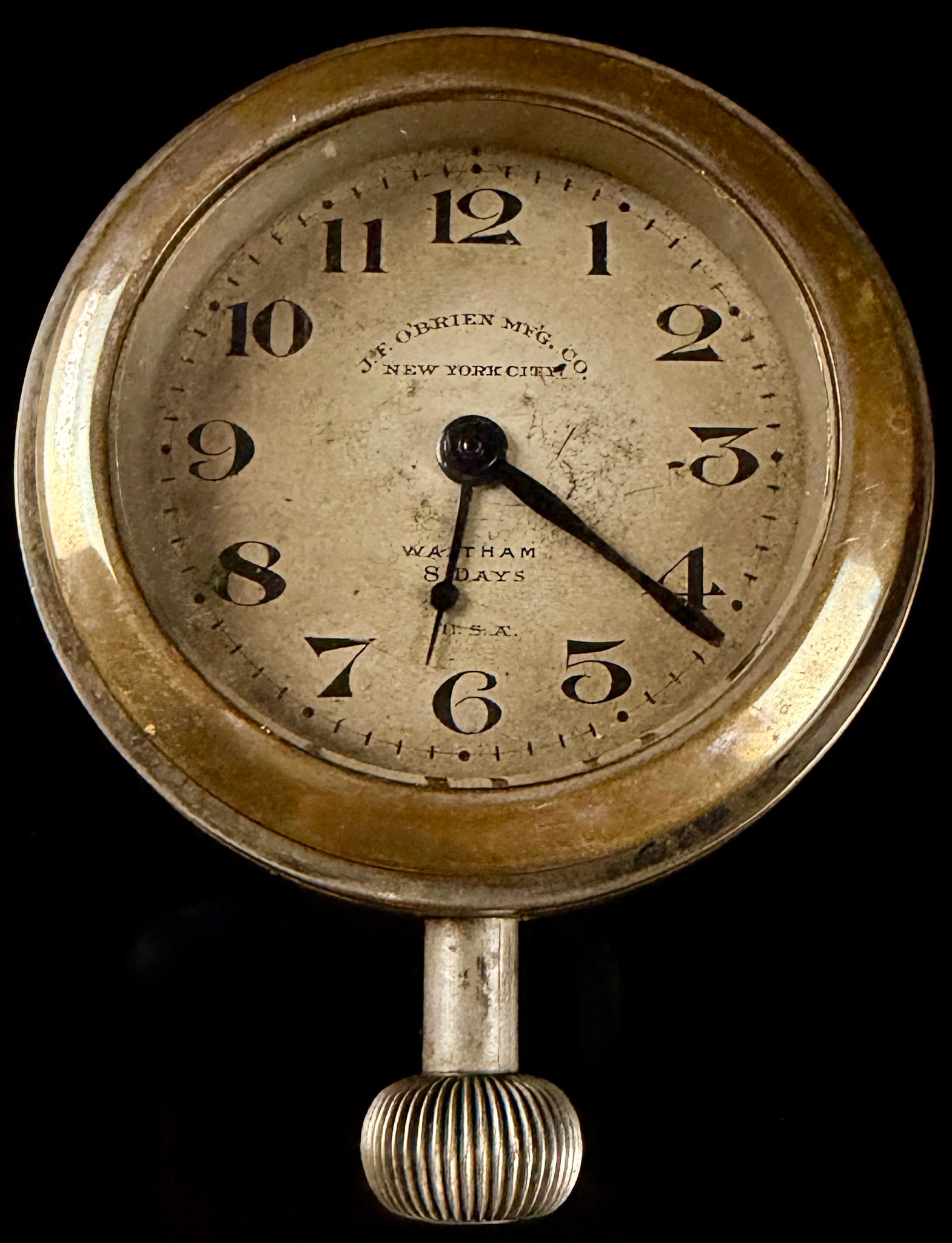 Waltham 8-Day Automobile Dash Clock for J.F. O'Brien Mfg. Co. New York City circa 1919: This is a mechanical manual-wind 8-day automobile dashboard clock manufactured by the Waltham Watch Company. The piece was retailed by or produced for the J.F. O'Brien Manufacturing Company of New Yor