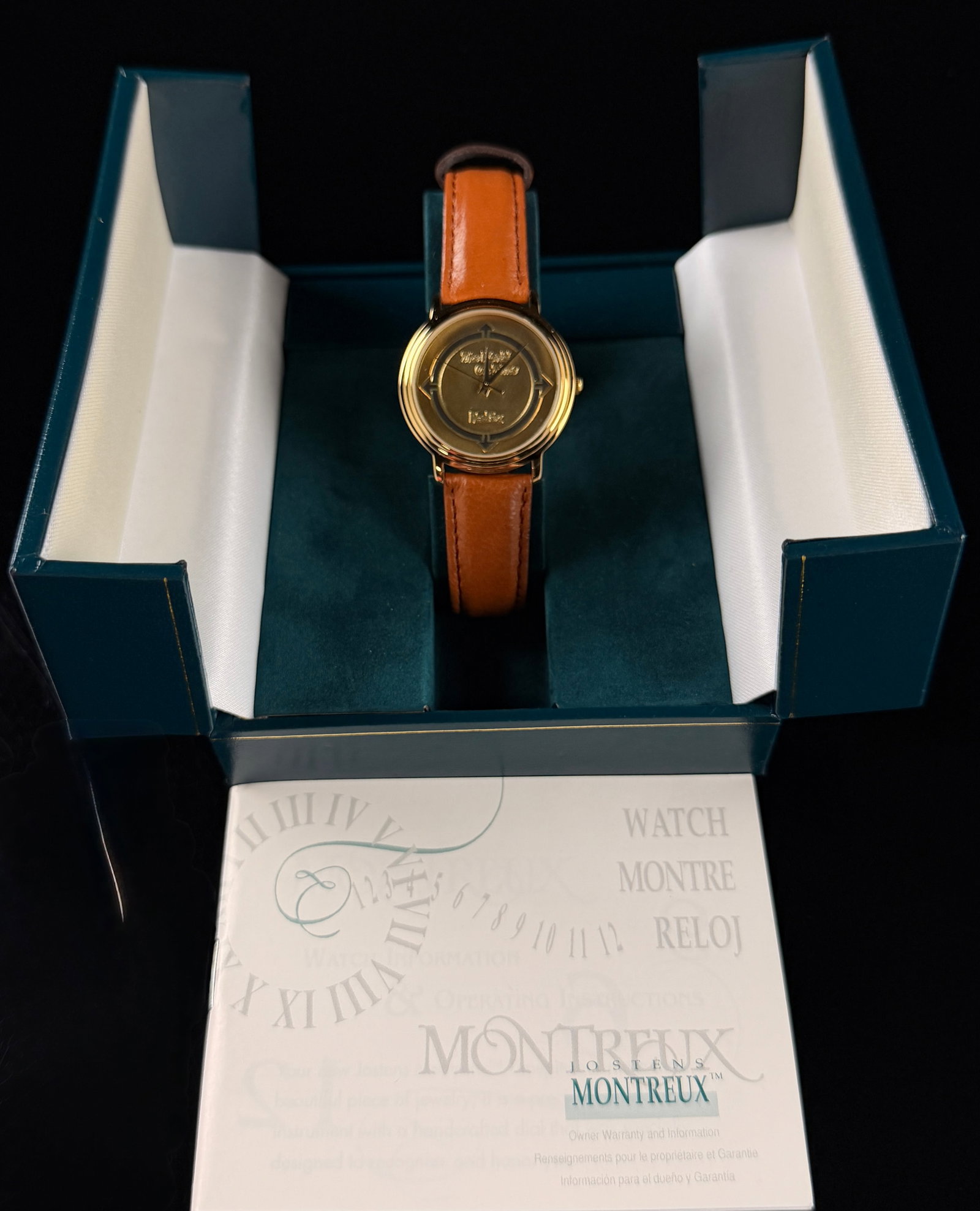 Montreux FedEx The World of Time Service Award Gold-Tone Quartz Wristwatch: Montreux by Jostens FedEx The World of Time corporate service award wristwatch. The timepiece features a gold-tone case and a gold-tone dial with a textured center. The dial displays the text The Worl