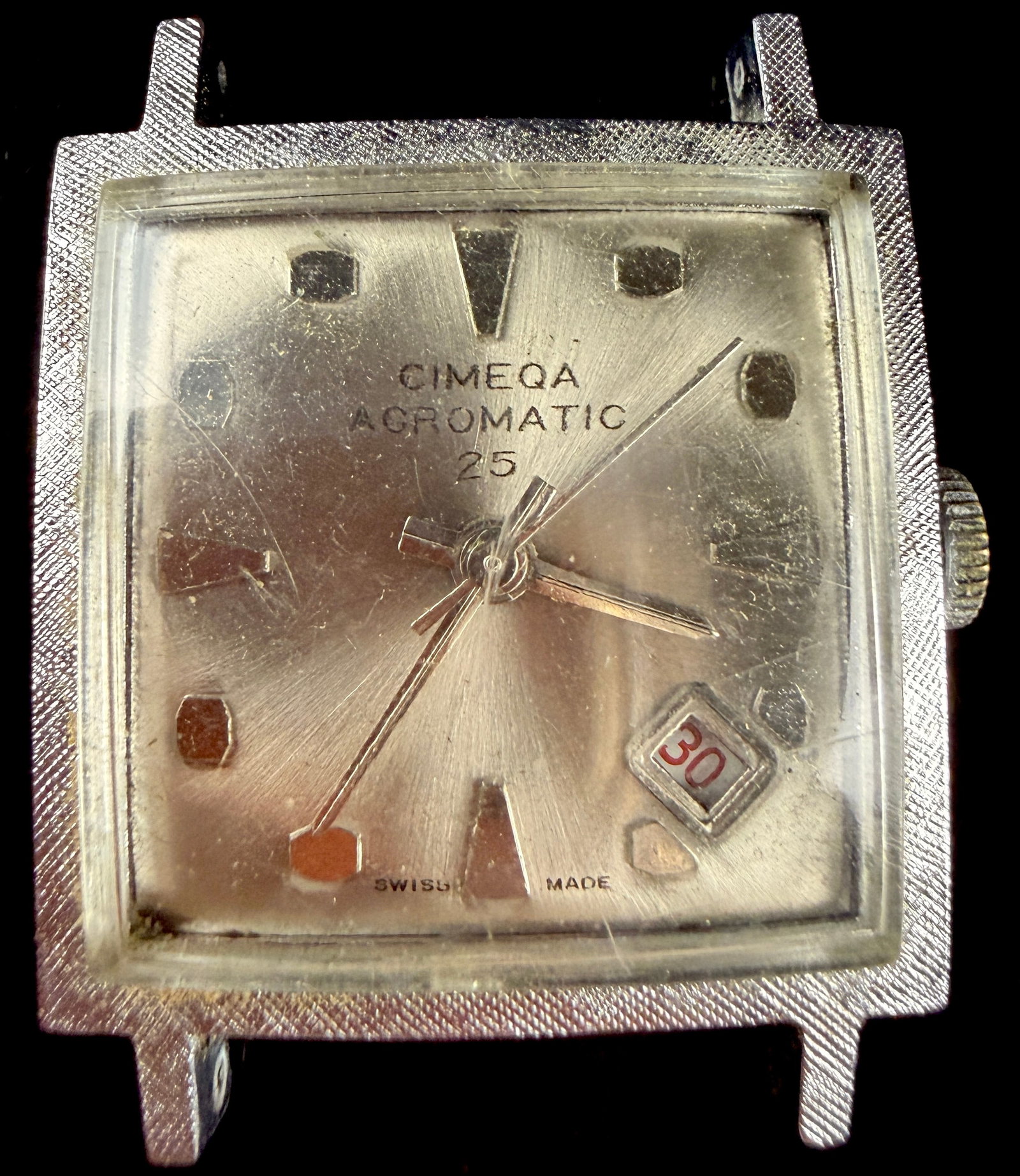 Cimega Acromatic 25 Square Chrome Plated Manual Wind Wristwatch: A vintage square-cased wristwatch by Cimega, model Acromatic 25. The timepiece features a base metal case with chrome plating and a silvered sunburst dial. The dial is set with applied polished indice