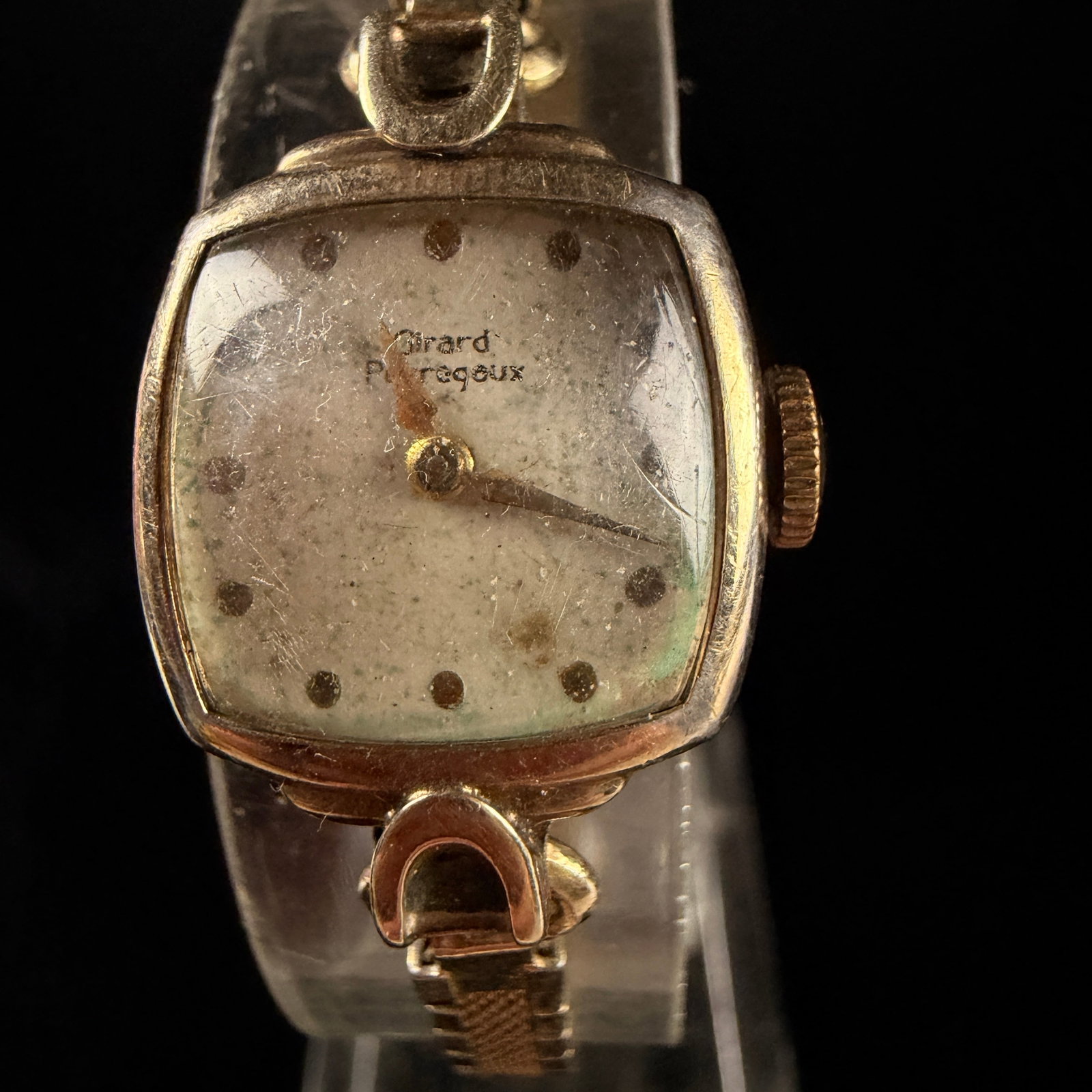 Girard-Perregaux Ladies Vintage 10K Gold Filled 17 Jewel Mechanical Watch Reference 61 290: A vintage ladies cocktail wristwatch by the Swiss manufacturer Girard-Perregaux. The timepiece features a 10 karat gold-filled case with a square-shaped dial. The dial is marked Girard Perregaux and f