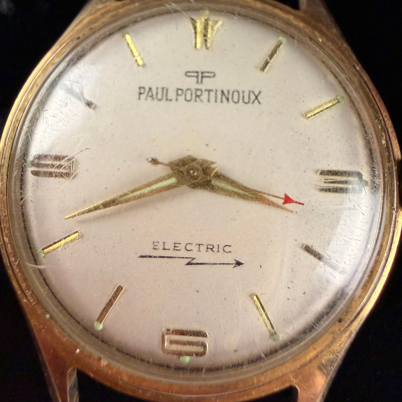 Paul Portinoux Electric Electro-Mechanical 14 Jewel Men's Wristwatch: A mid-century Paul Portinoux men's wristwatch featuring an early electro-mechanical movement. The off-white dial displays a stylized double P logo below the 12 o'clock position and is marked Electric 