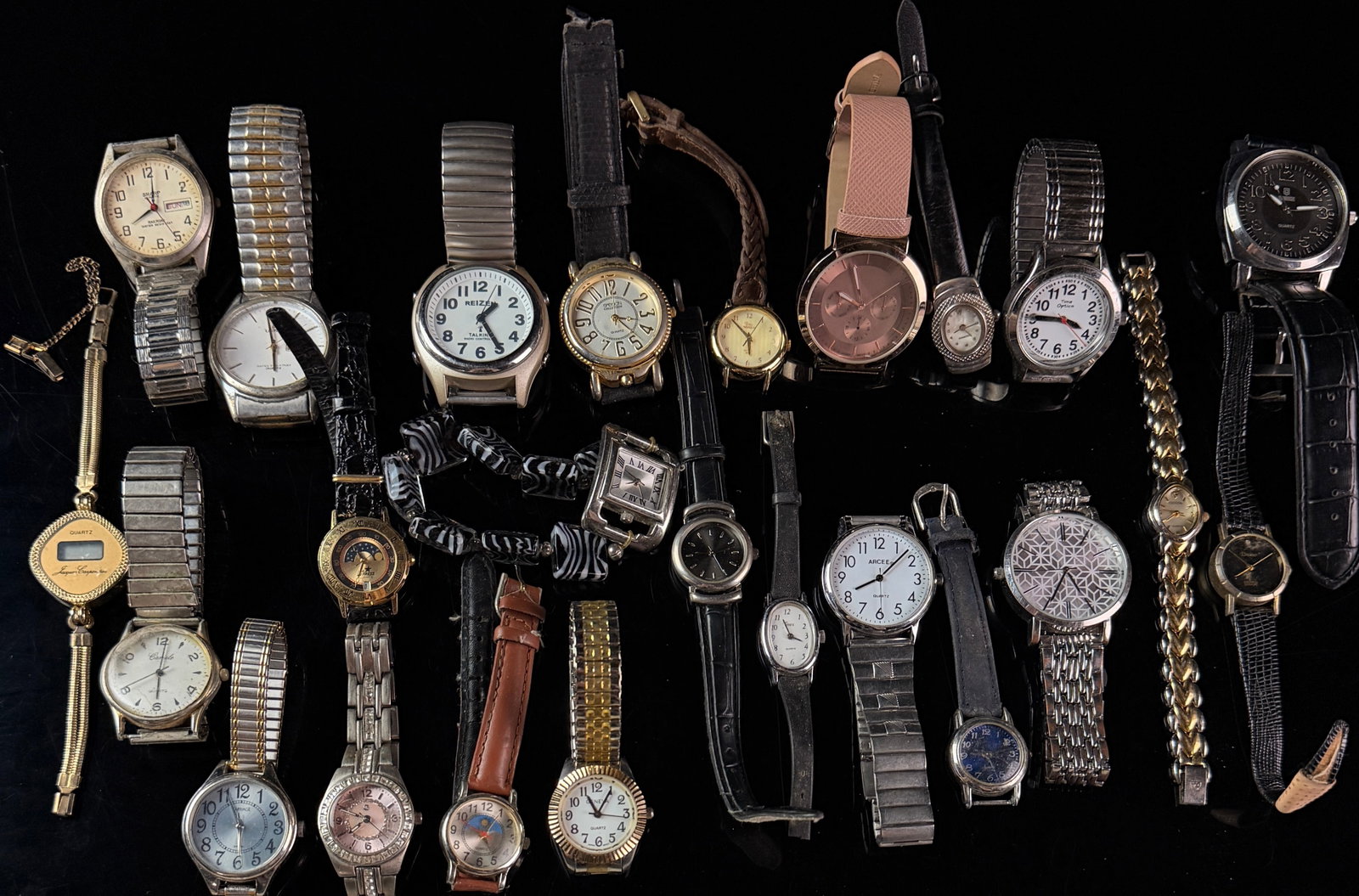 An Assortment of Men's and Women's Quartz Wristwatches for Parts and Repair: This collection consists of approximately 25 assorted wristwatches, primarily featuring quartz movements. The lot includes a diverse range of brands such as Sharp, Lorus, Reizen, Croton, Jacques Carpe