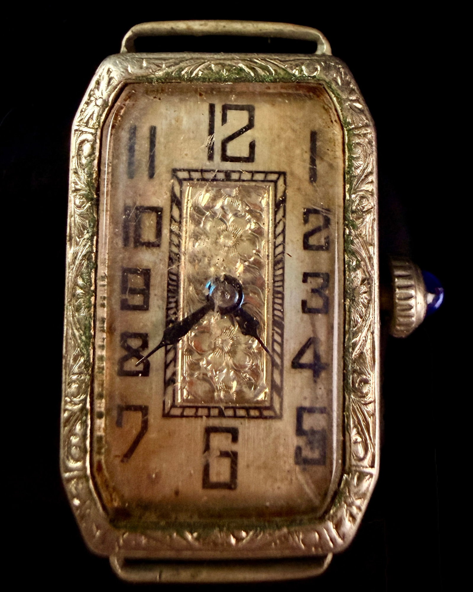 Blum Watch Co. Art Deco White Gold Filled Ladies Tank Wristwatch: An Art Deco period ladies manual wind tank wristwatch by the Blum Watch Co. and Sirom Watch Co. The rectangular white metal case, likely white gold filled, features elaborate hand-chased foliate and f