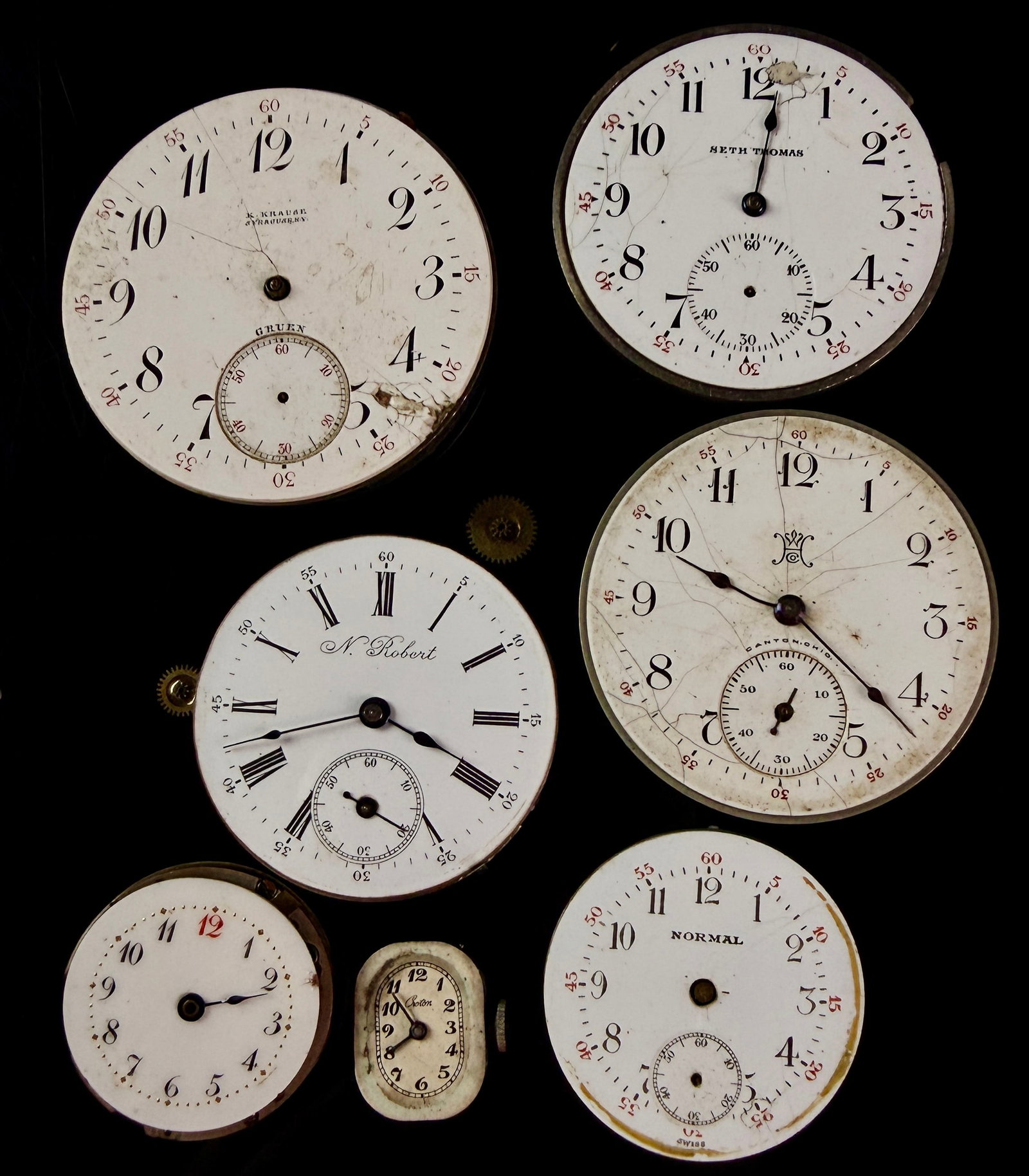An Assortment of Antique and Vintage Pocket Watch and Wristwatch Movements for Parts: An assortment of manual wind watch movements and dials intended for horological repair or restoration. The grouping includes a Gruen movement marked for K. Krause, Syracuse, N.Y., featuring a safety p