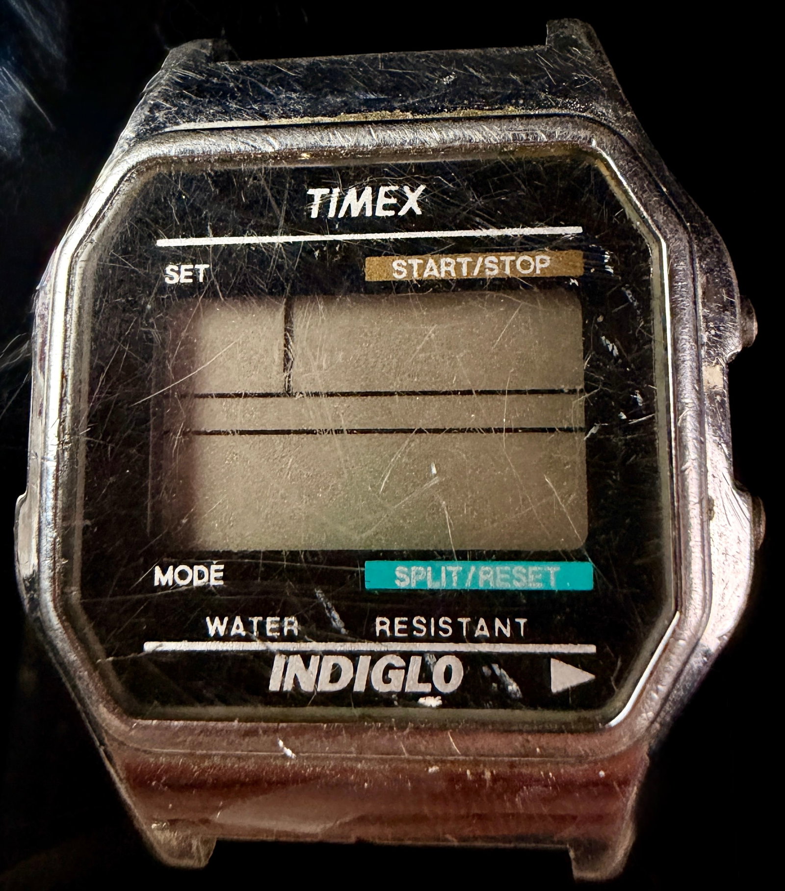 Timex Indiglo Digital Wristwatch Reference 739: A vintage Timex Indiglo digital wristwatch, disassembled and offered for parts or restoration. The timepiece features a chrome-plated base metal case with a stainless steel case back. The black