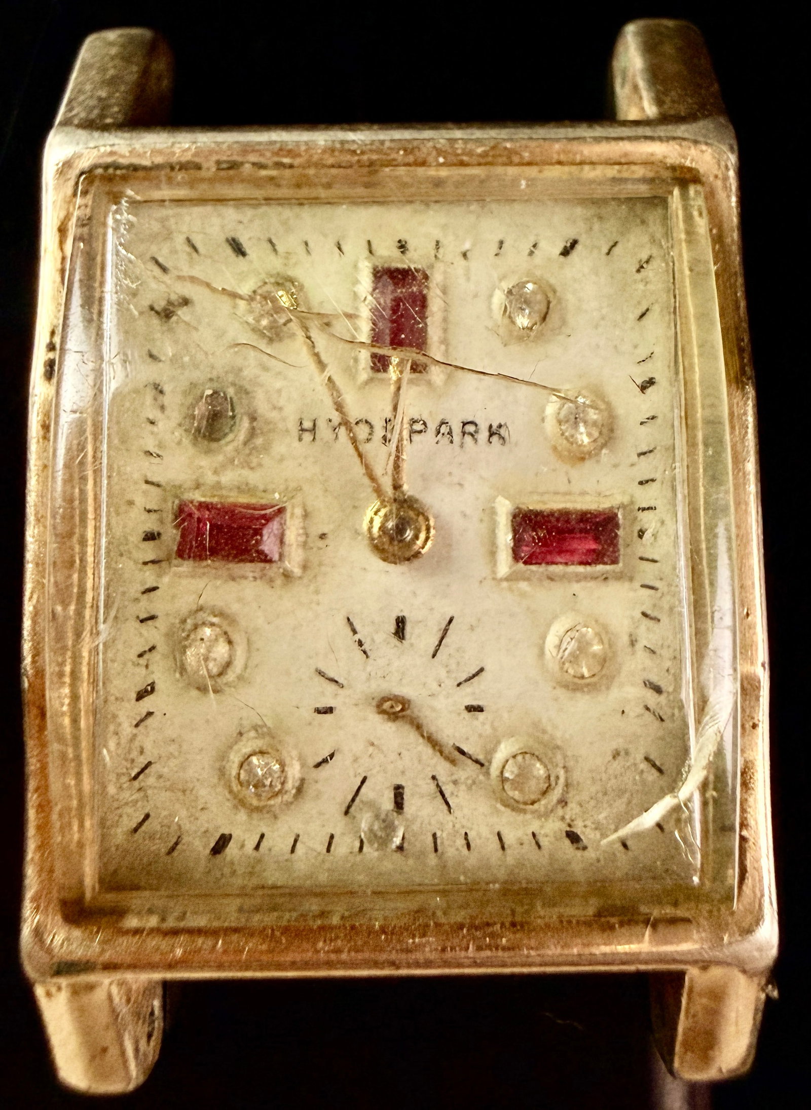 Hyde Park Vintage Manual Wind Tank Style Wristwatch Head with Jeweled Dial: This is a vintage Hyde Park manual-wind wristwatch head in a rectangular Tank style. The watch features a gold-tone metal case with a stainless steel snap-back. The cream-colored dial is detailed
