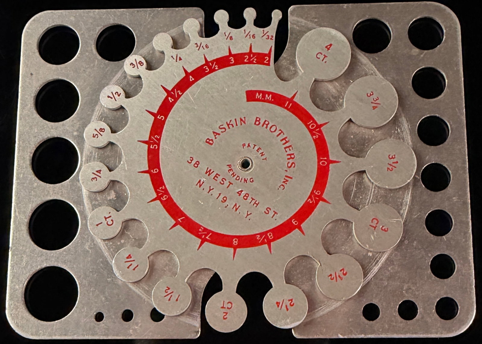 Baskin Brothers Aluminum Jeweler's Stone and Ring Gauge Calculator: A vintage jeweler's stone and ring gauging instrument manufactured for Baskin Brothers, Inc. of New York. The two-part tool is constructed of brushed aluminum with red lithographed scales and text. Th