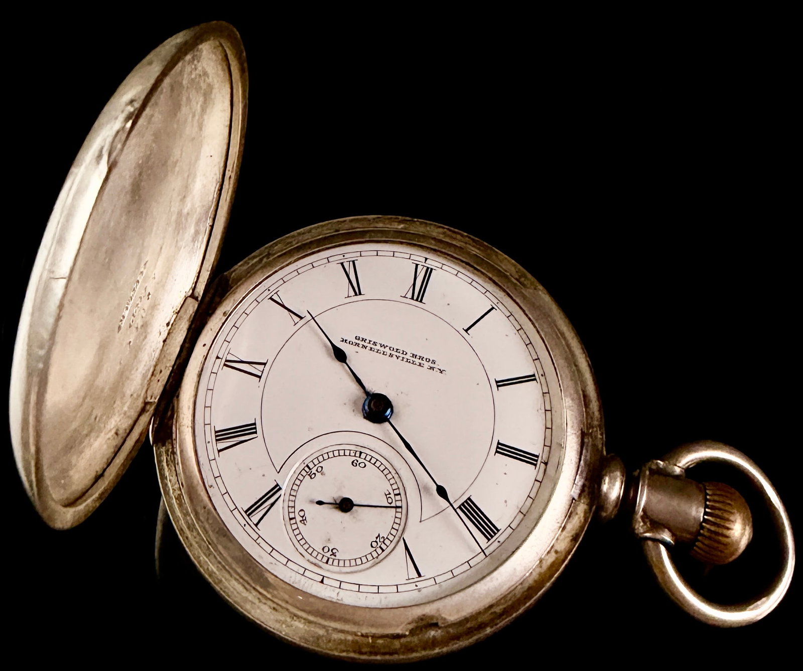 Columbus Watch Co. Coin Silver 18s Hunting Case Pocket Watch Retailer Griswold Bros: A 19th-century American hunting case pocket watch manufactured by the Columbus Watch Co. of Columbus, Ohio, and retailed by Griswold Bros. of Hornellsville, New York. The 18-size coin silver case is s
