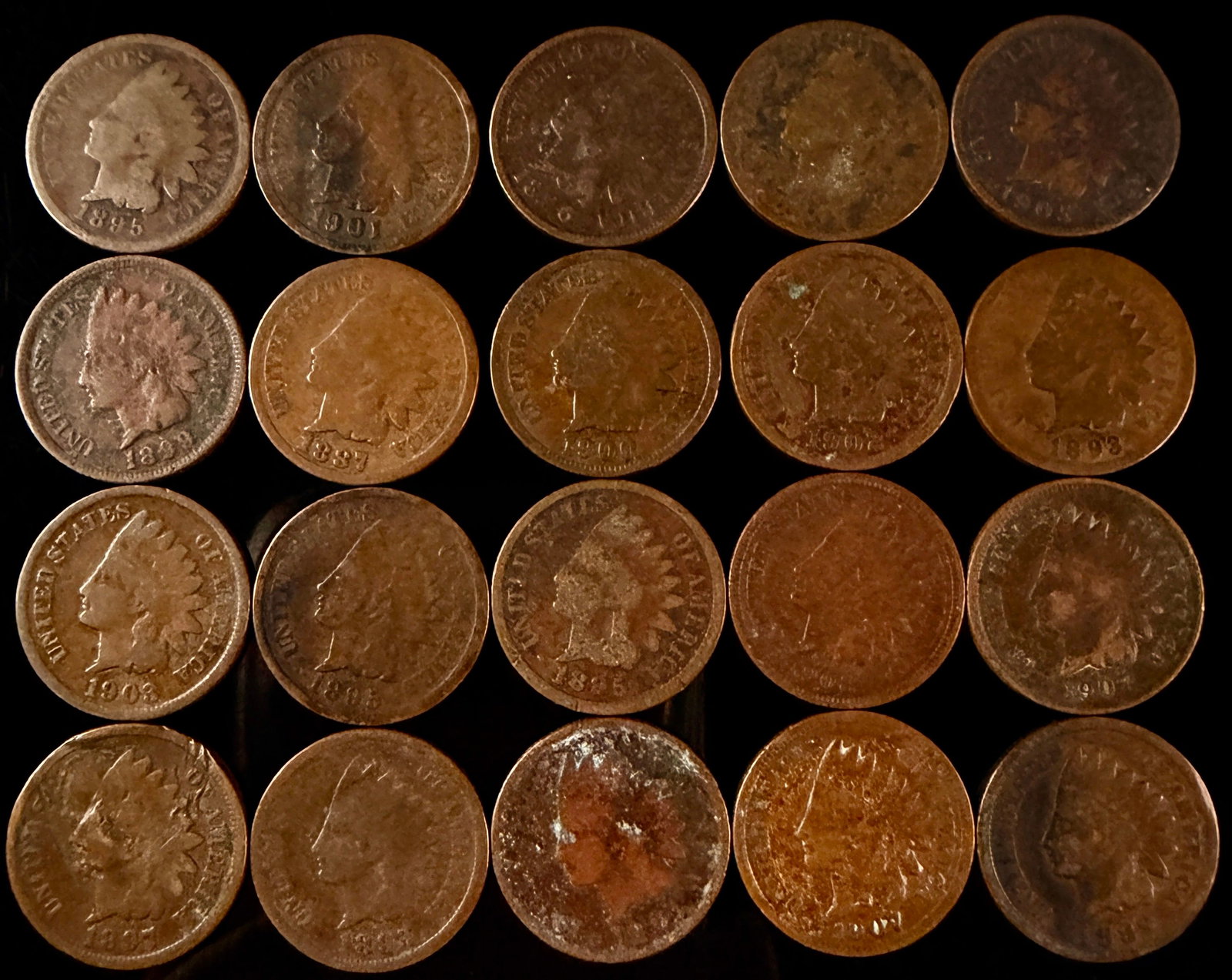 A Collection of US Indian Head One-Cent Coins: A collection of bronze one-cent coins issued by the US. The obverse of each coin features a profile of Liberty wearing a Native American headdress, surrounded by the circumscribed text UNITED STATES O