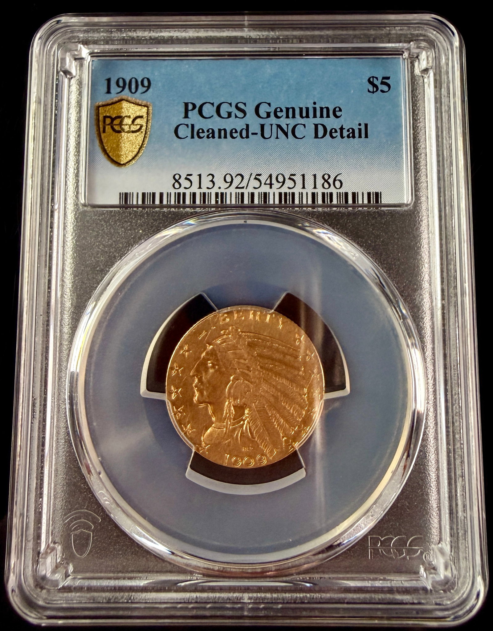 1909 US $5 Indian Head Gold Half Eagle PCGS: A 1909 US $5 gold Half Eagle coin. The coin is composed of 0.900 fine gold with a gold bullion content of 0.2419 ounces AGW. It is encapsulated in a third-party grading slab from PCGS. The obverse of 
