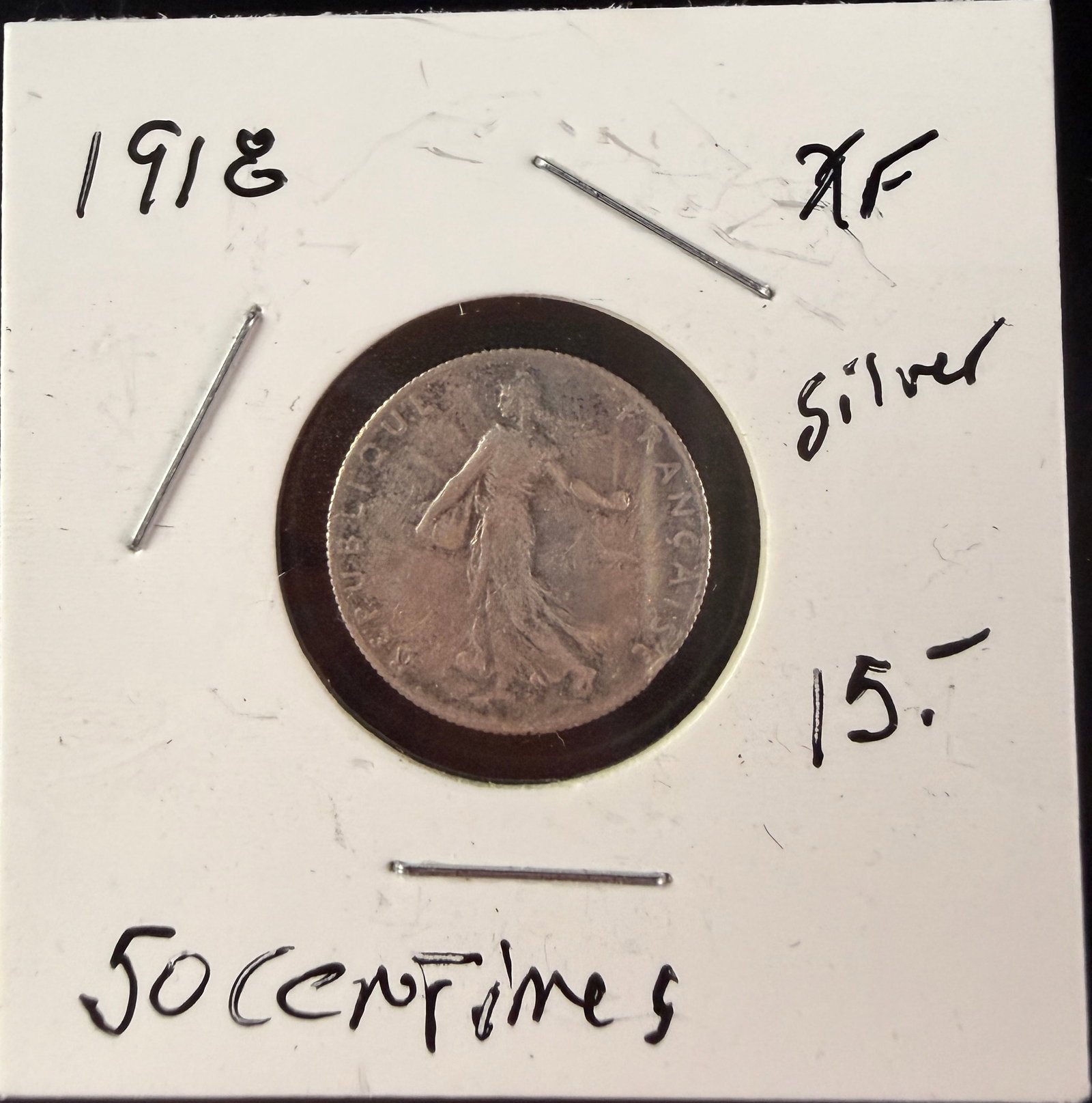FR 1918 Silver 50 Centimes Coin: A 1918 silver 50 Centimes coin from France struck in .835 fine silver. The obverse features the Sower design with the inscription REPUBLIQUE FRAN?‡AISE. The reverse displays the denomination 50