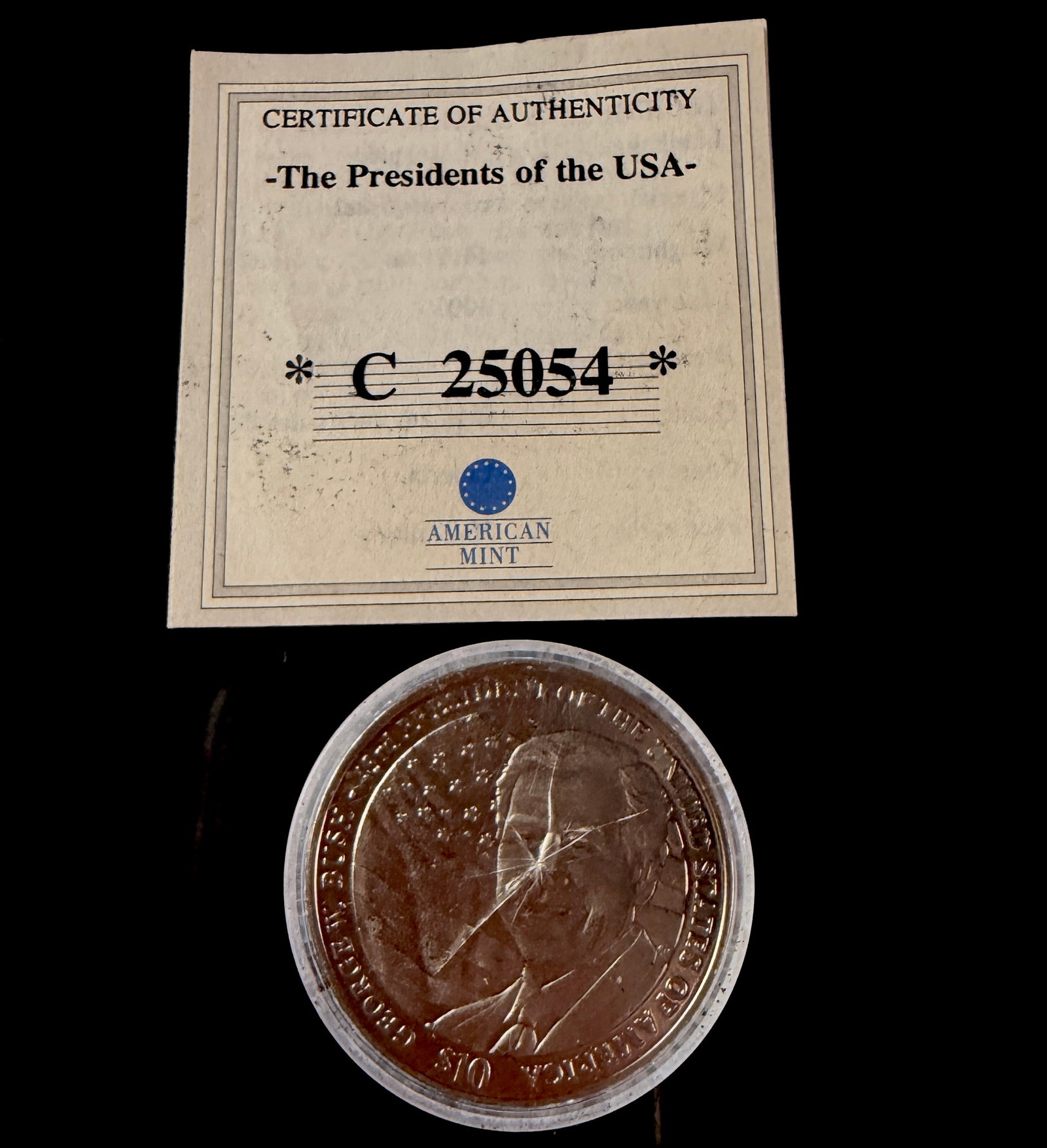 American Mint 2001 Liberia $10 George W. Bush Commemorative Coin: This 2001 Republic of Liberia $10 commemorative coin was produced by the American Mint as part of The Presidents of the USA series. The silver-toned coin features an obverse portrait of George W. Bush