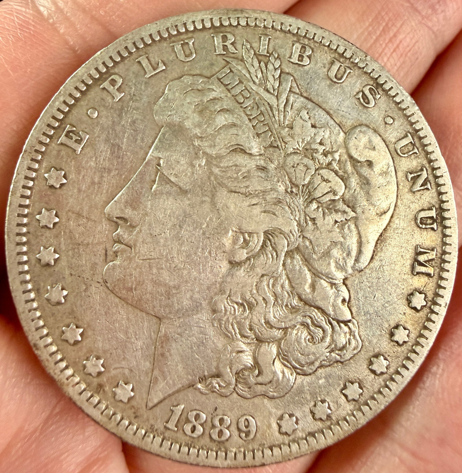 1889-O US Morgan Silver Dollar (1 of 3)